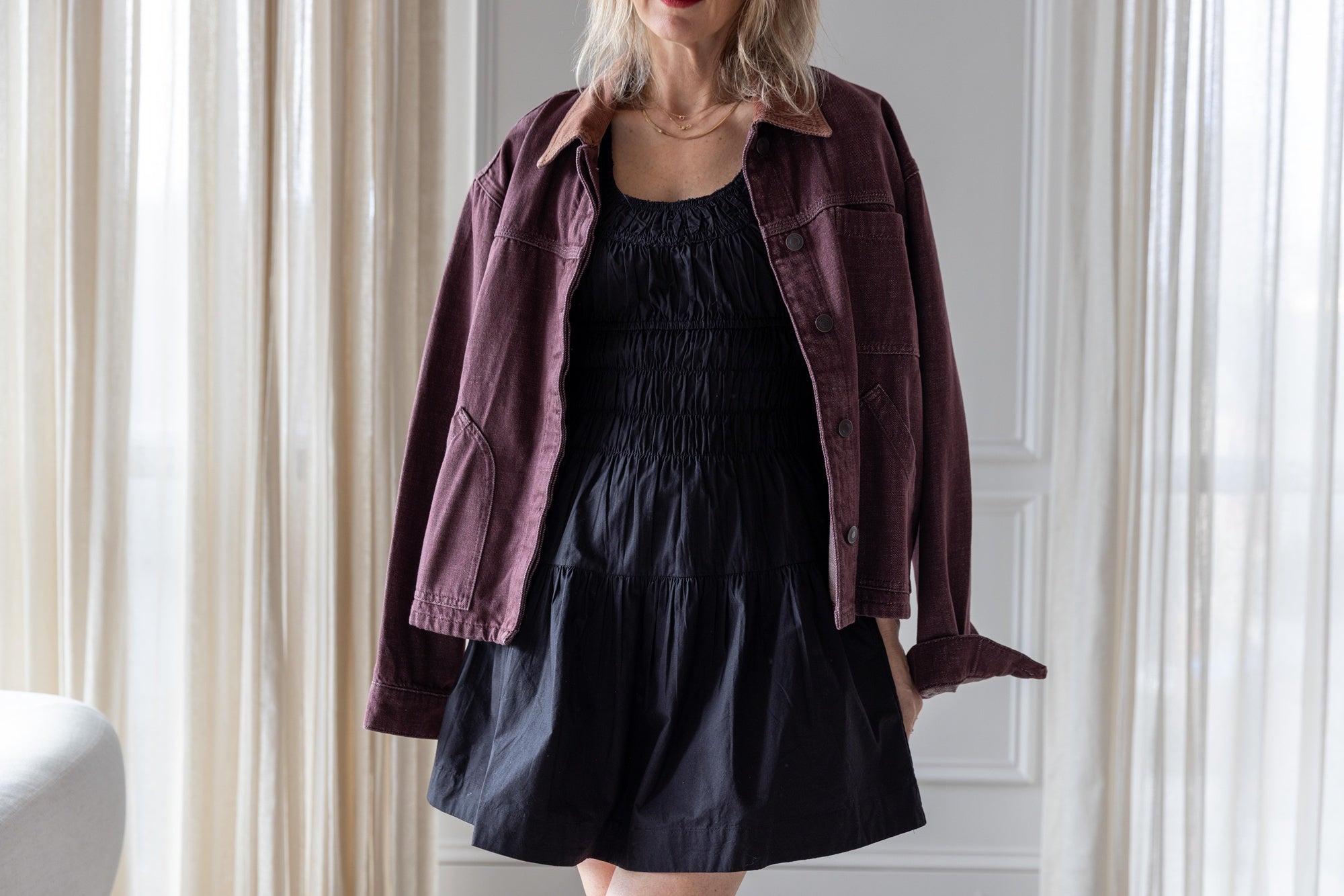 image of a woman wearing the Ciao Lucia Kala dress and Jeanerica Nua Denim Jacket