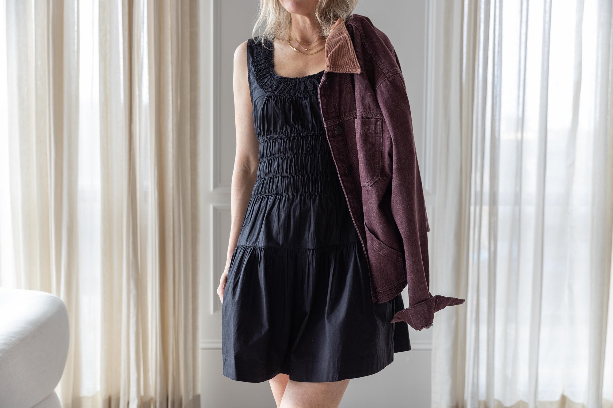 image of a woman wearing the Ciao Lucia Kala dress and Jeanerica Nua Denim Jacket