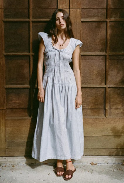 image of a woman wearing the Ciao Lucia Lauretta Dress
