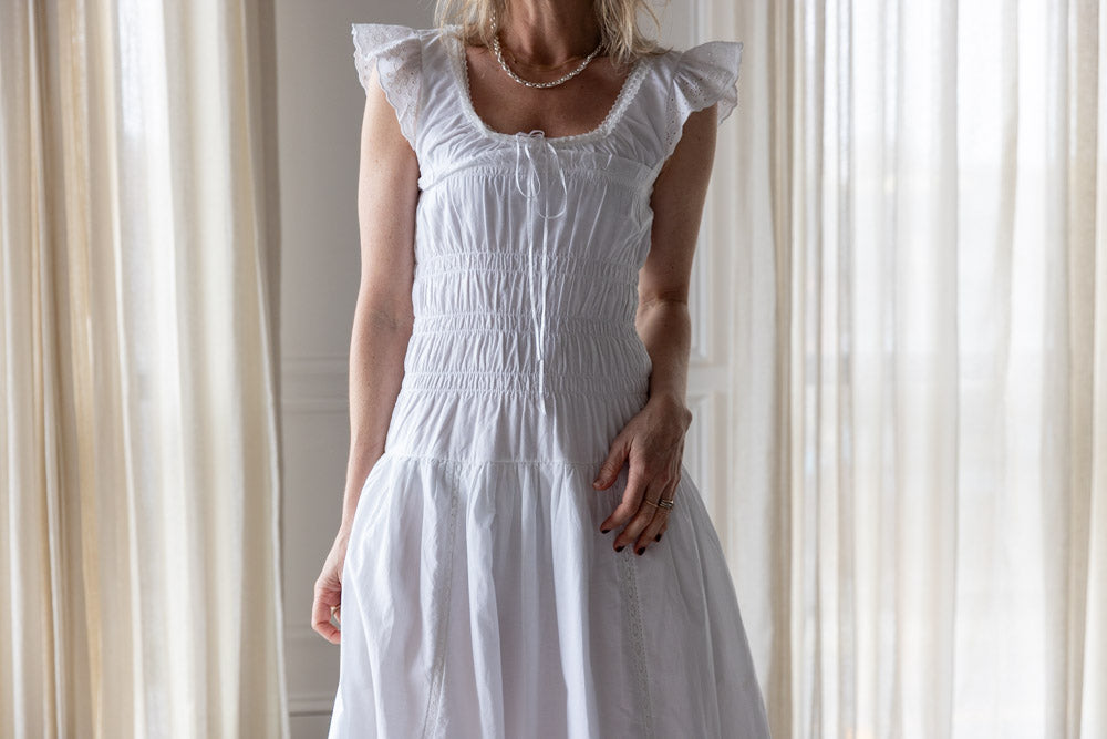 image of a woman wearing the Ciao Lucia Lauretta Dress