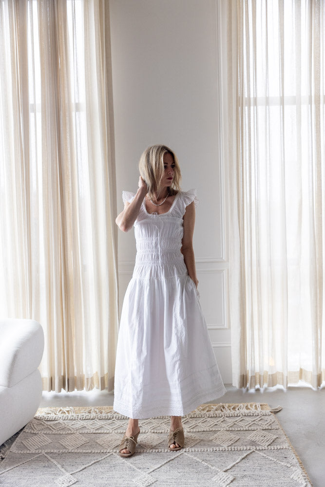 image of a woman wearing the Ciao Lucia Lauretta Dress