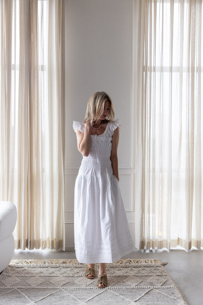image of a woman wearing the Ciao Lucia Lauretta Dress