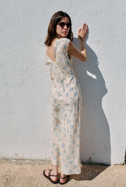 back image of a model wearing the Ciao Lucia Marja Dress