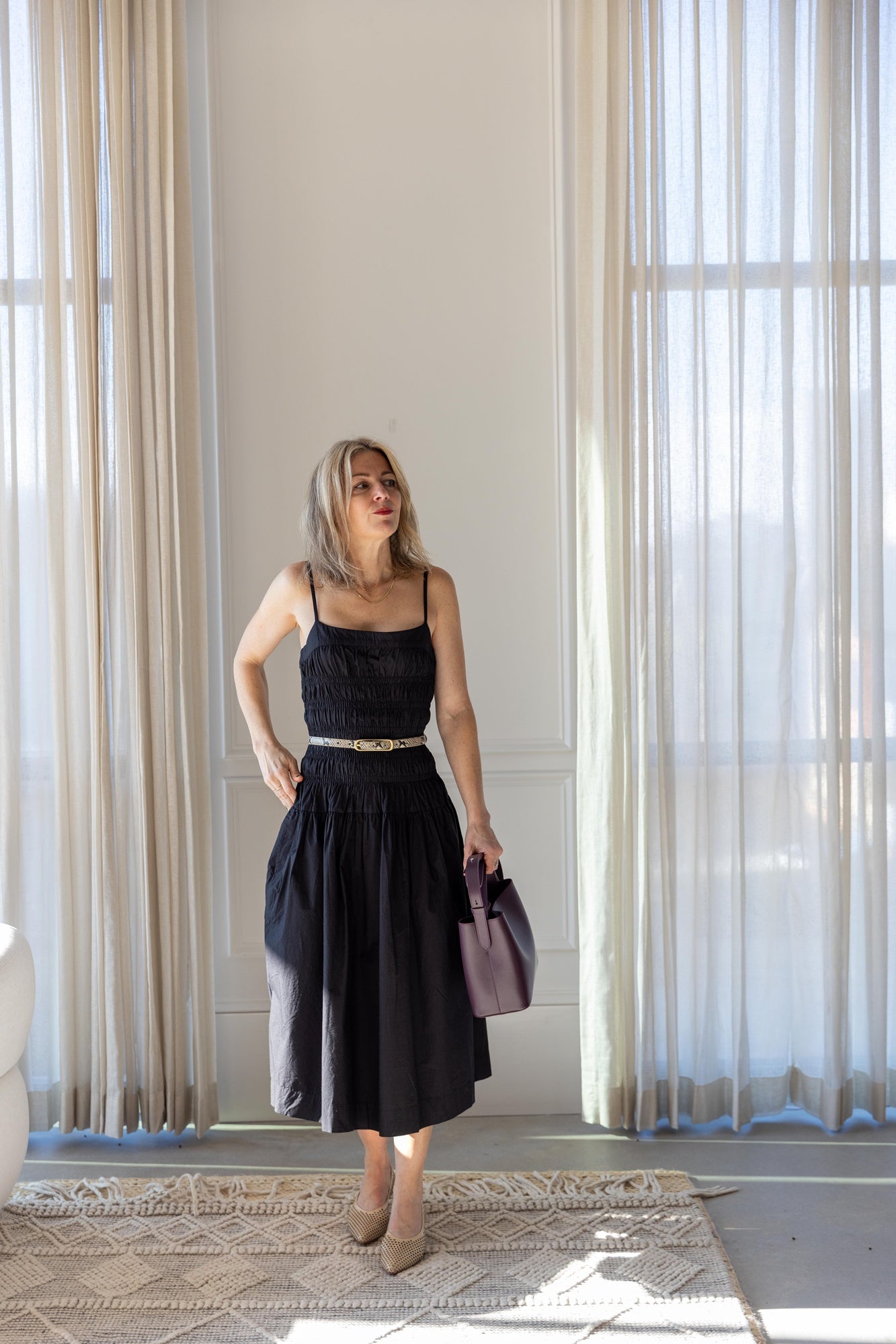 image of a woman wearing the Ciao Lucia Rosella Dress 