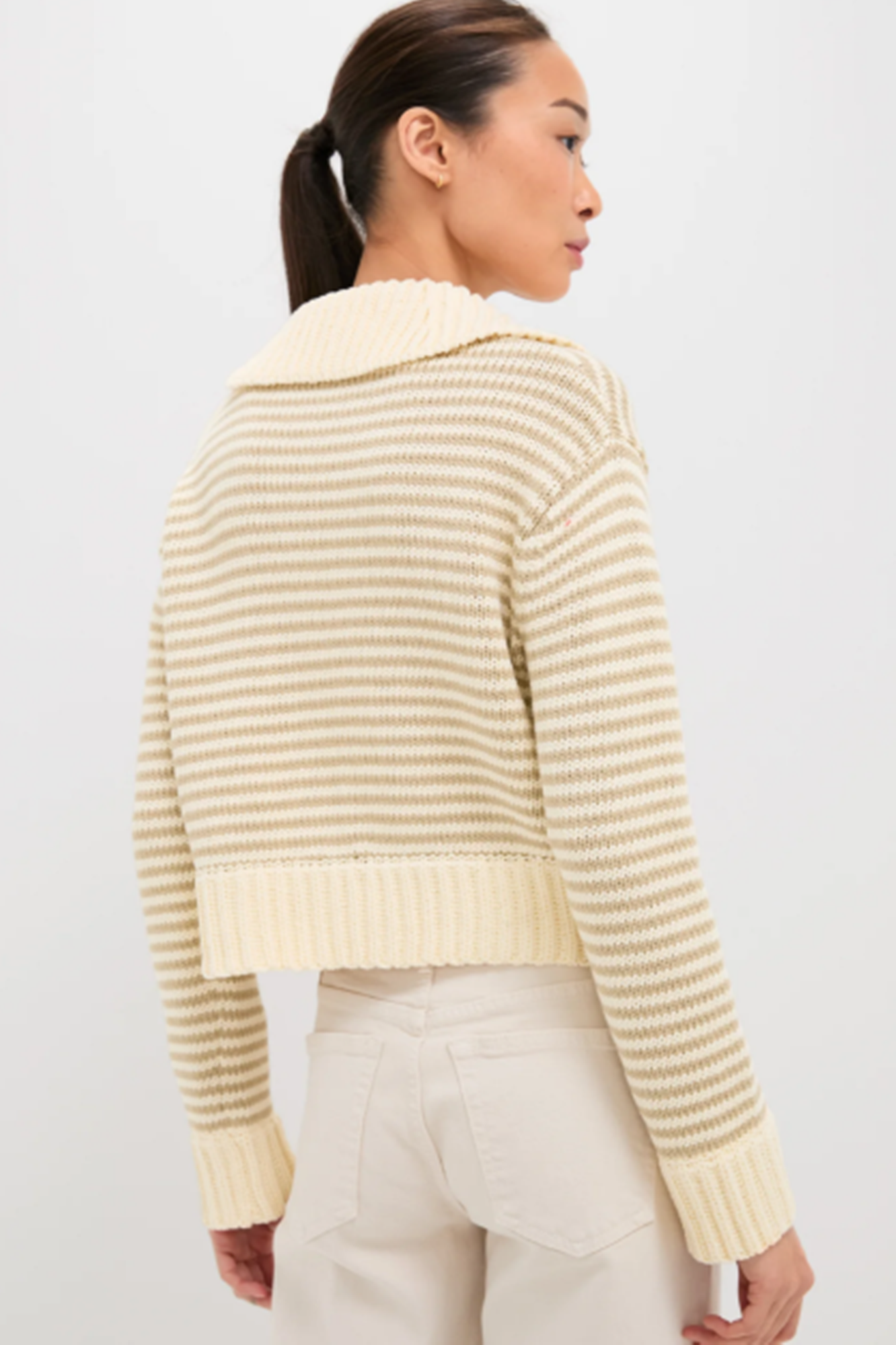 back of model wearing doro striped henley sweater.