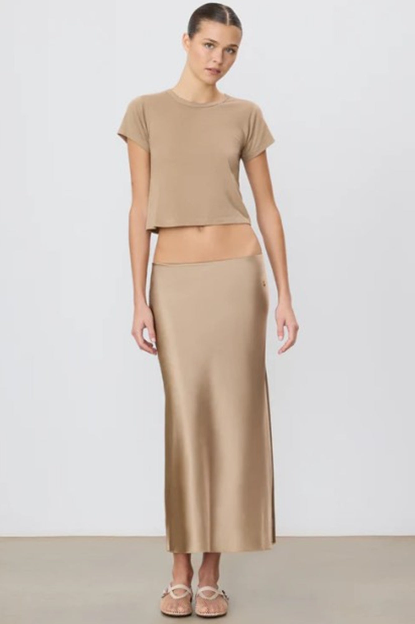 image of a model wearing the Eterne Camila Midi Skirt in Taupe