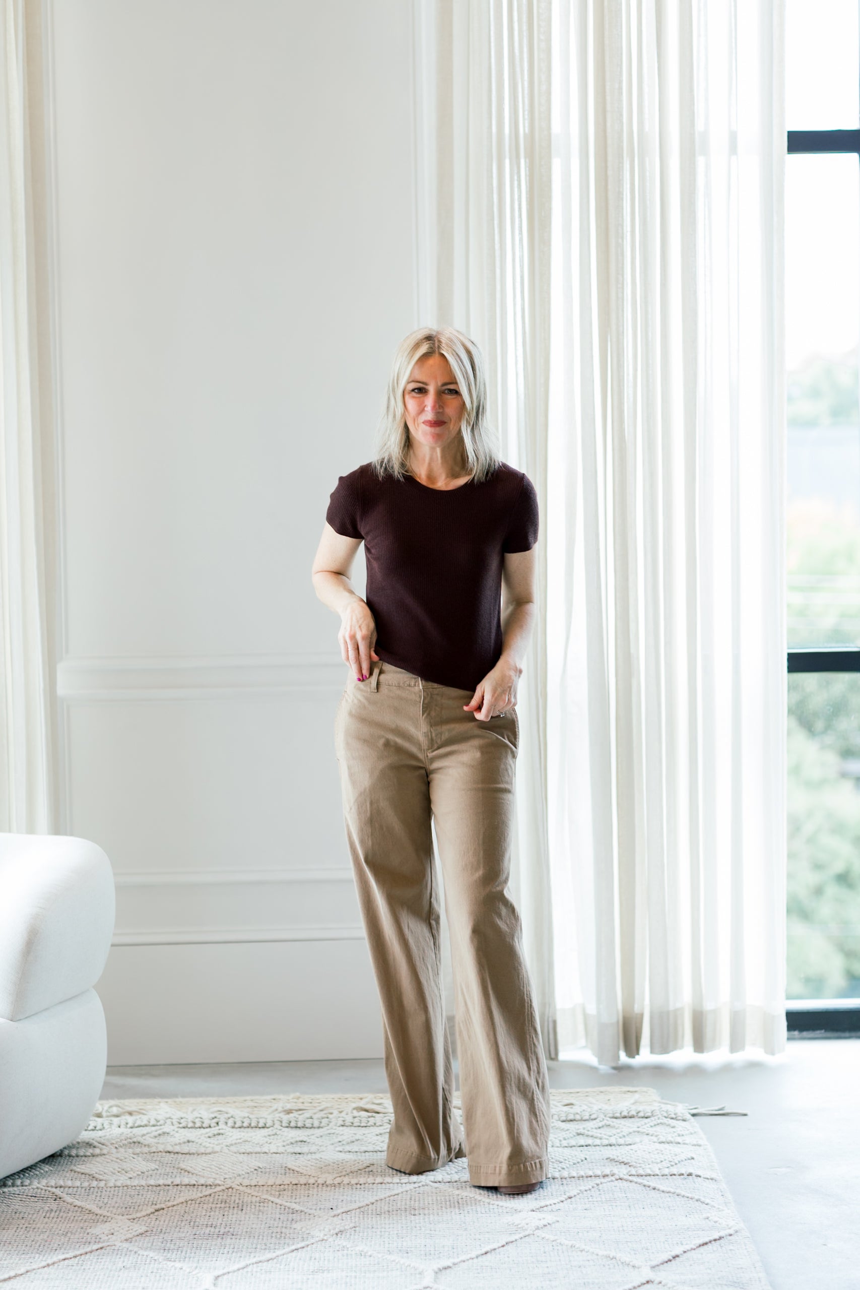 image of a woman wearing the eterne rib stitch tee in espresso and amo maddi trousers