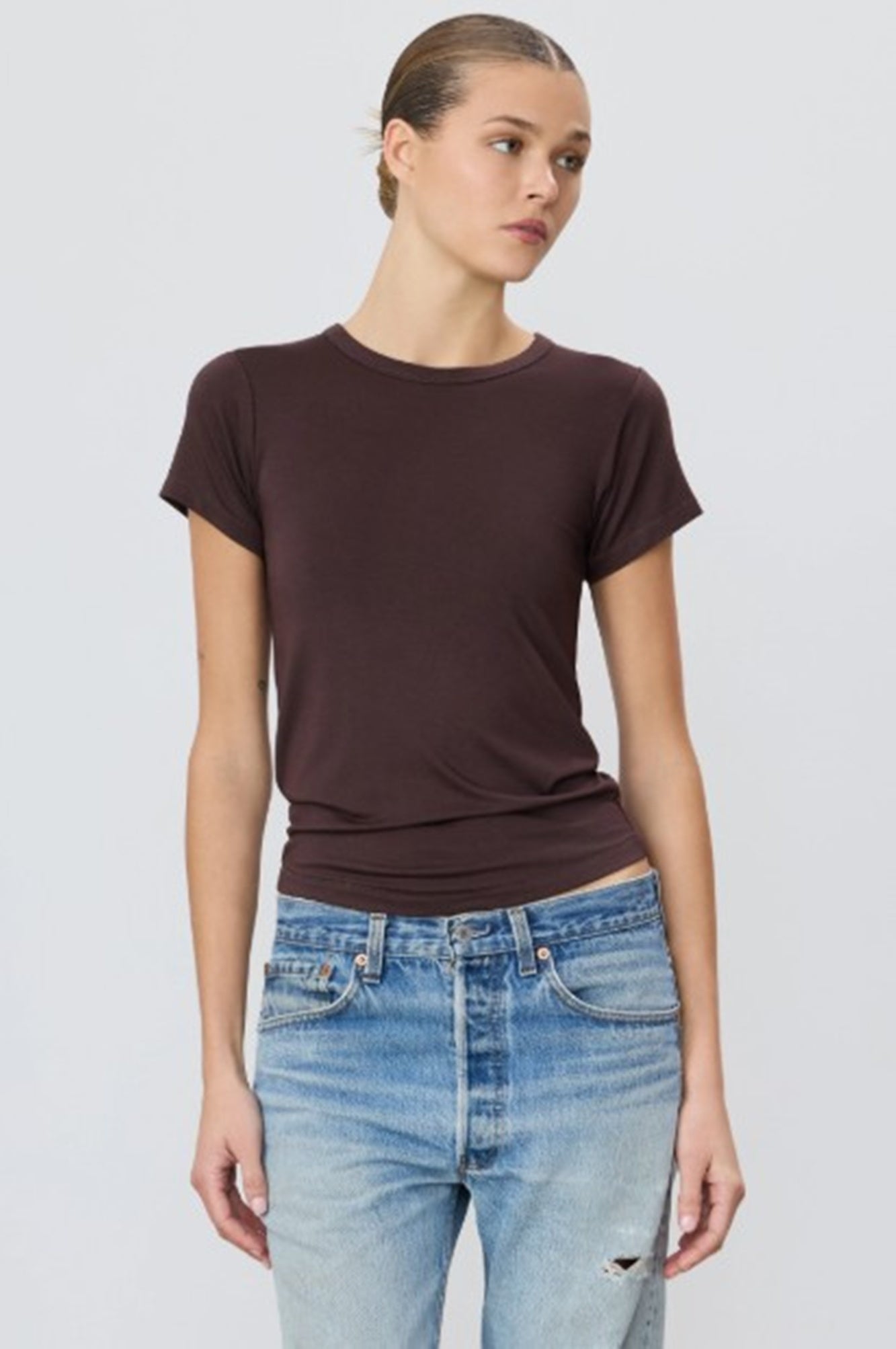 image of a woman wearing the Eterne fitted crewneck short sleeve tee in espresso brown