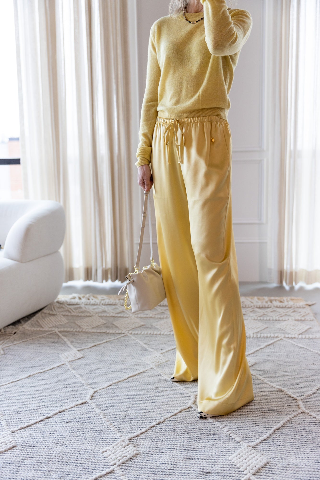 image of a woman wearing the Eterne Francis Sweater and Brody Pant