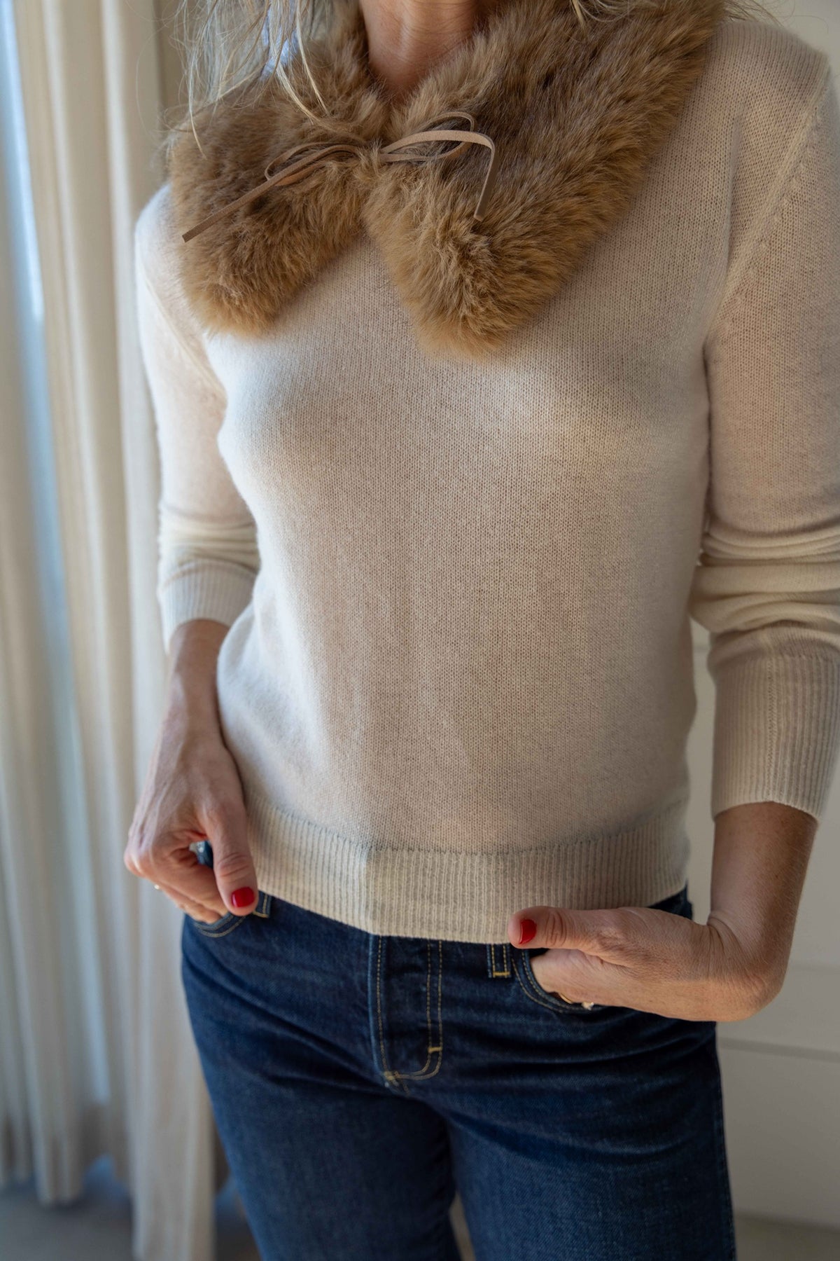by Malene Birger Cowie Faux Fur Scarf in Tannin worn at the neck over the Eterne Francis Sweater in Cream with dark jeans