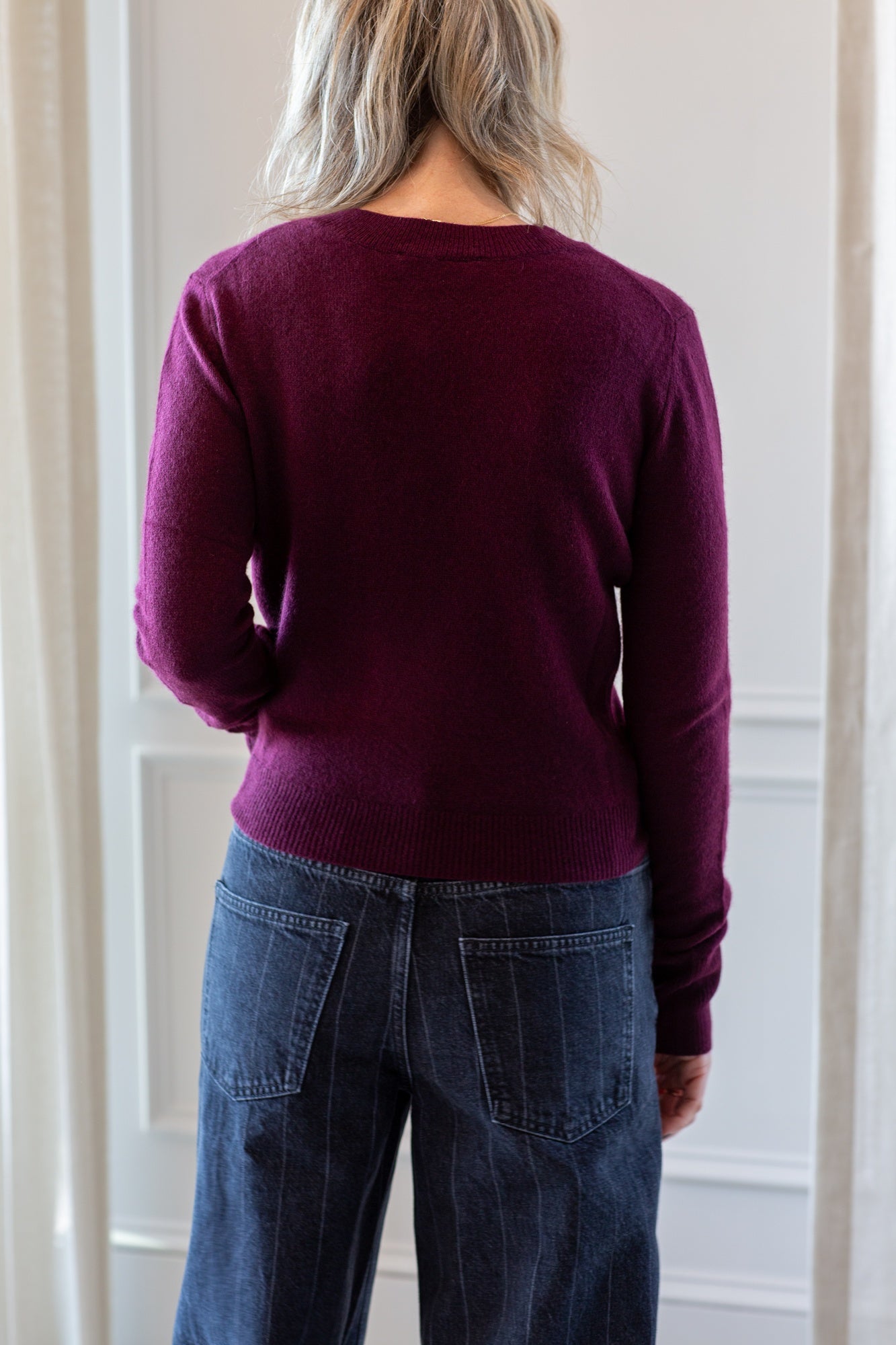 back of model wearing the Eterne Francis Sweater in oxblood