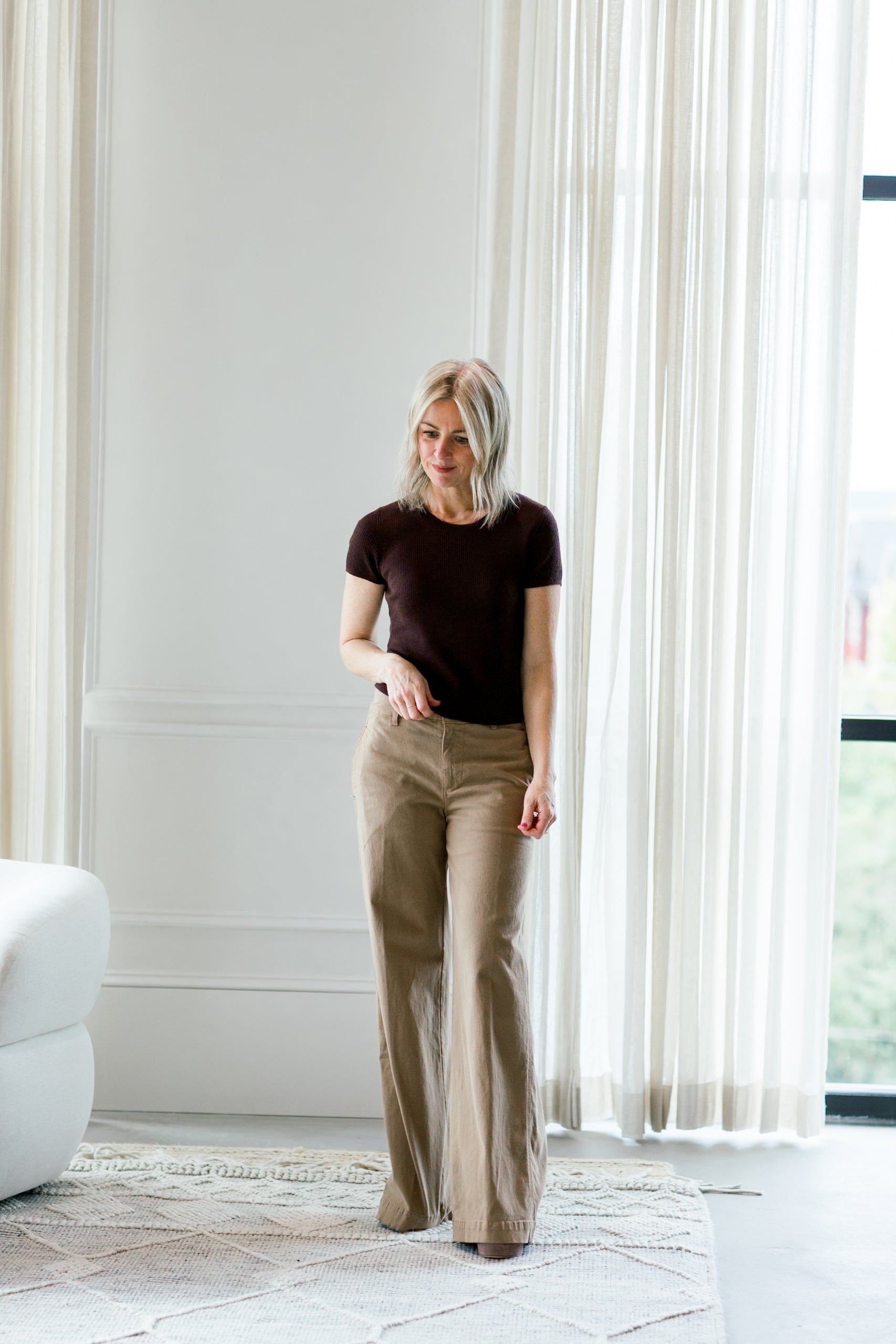 image of a woman wearing the eterne rib stitch tee in espresso and amo maddi trousers