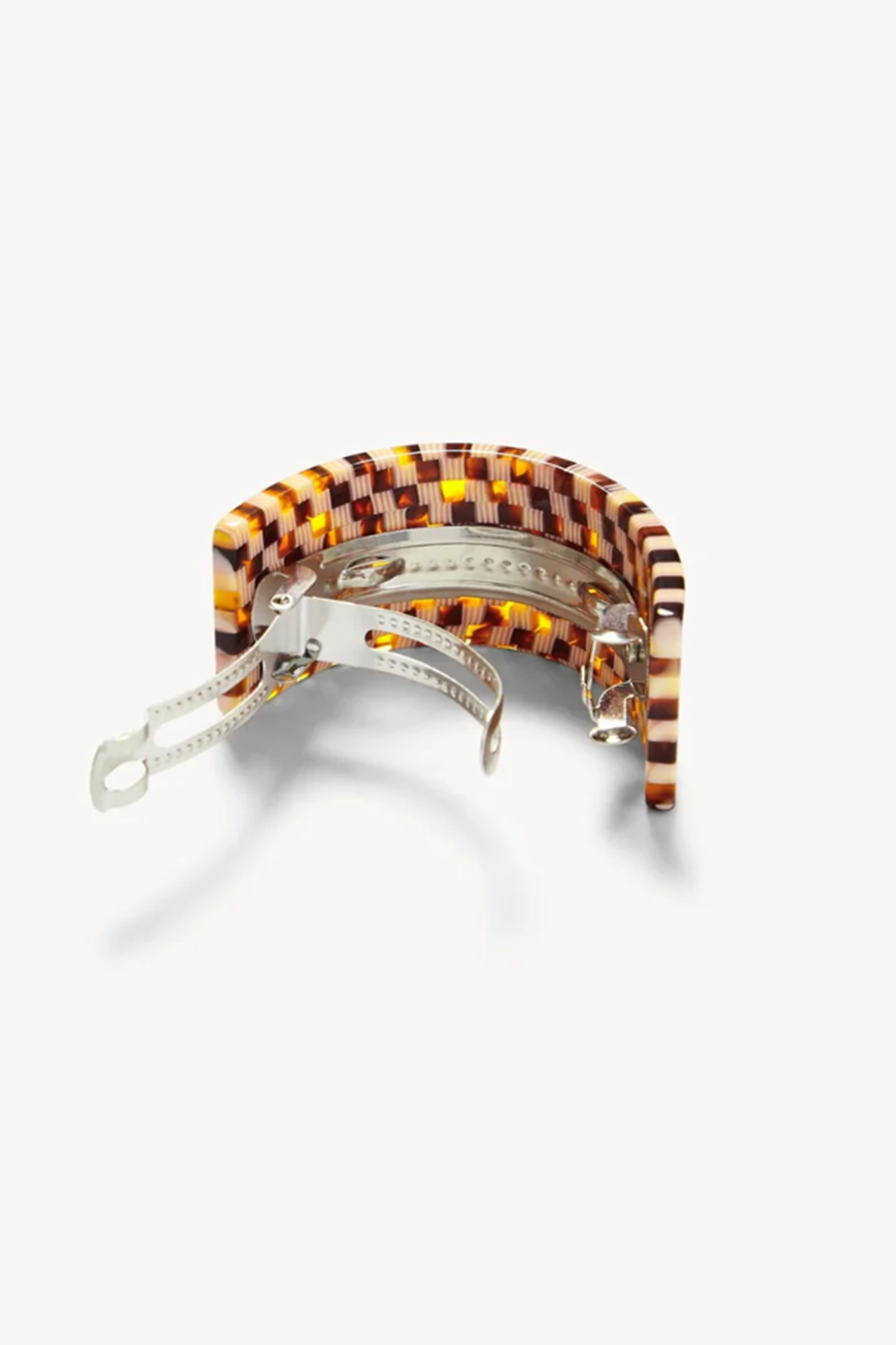 Back side of a tortoise checked french pony barrette on a white background