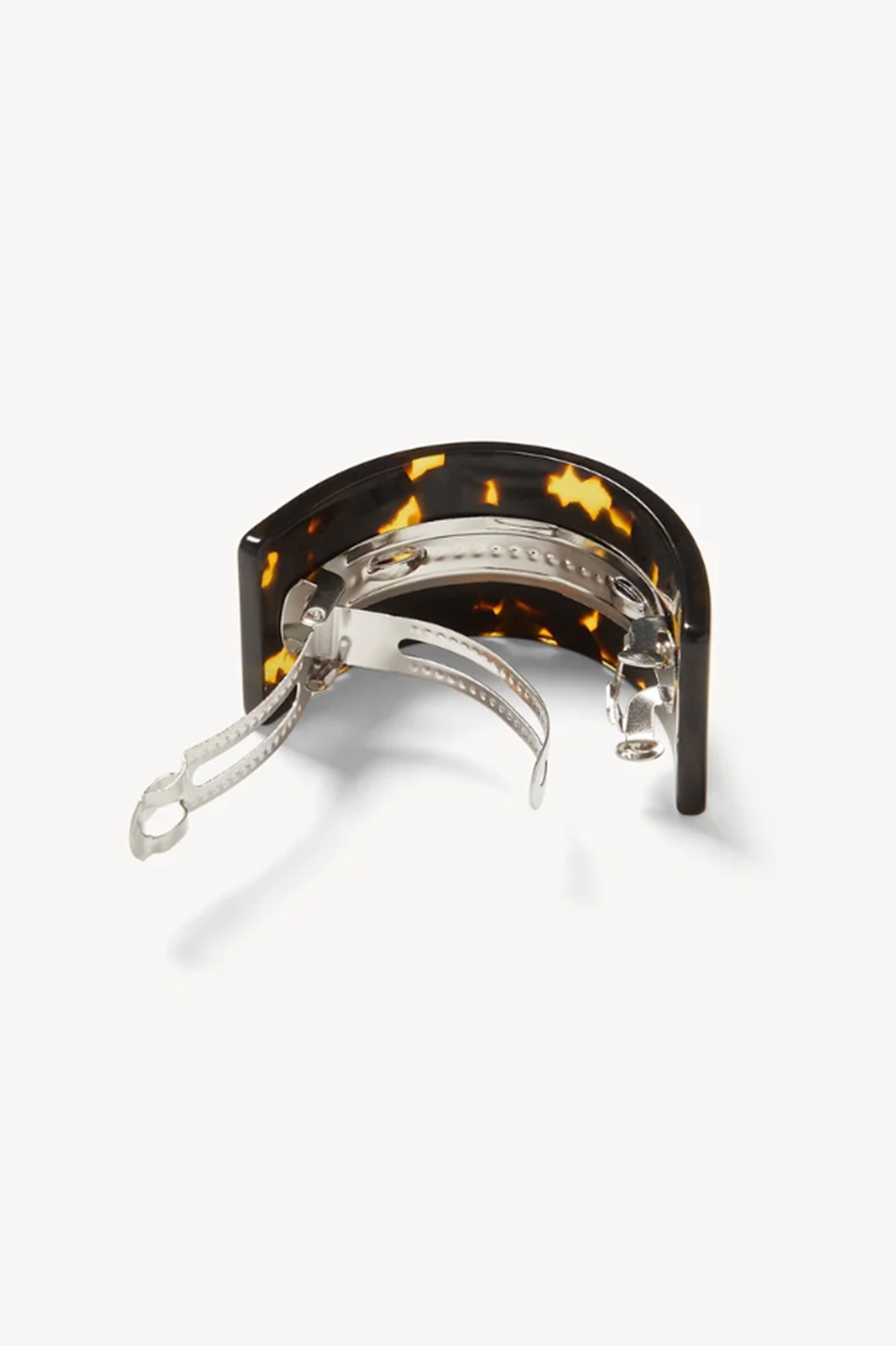Back side of a tortoiseshell checked frech pony barrette on a white background