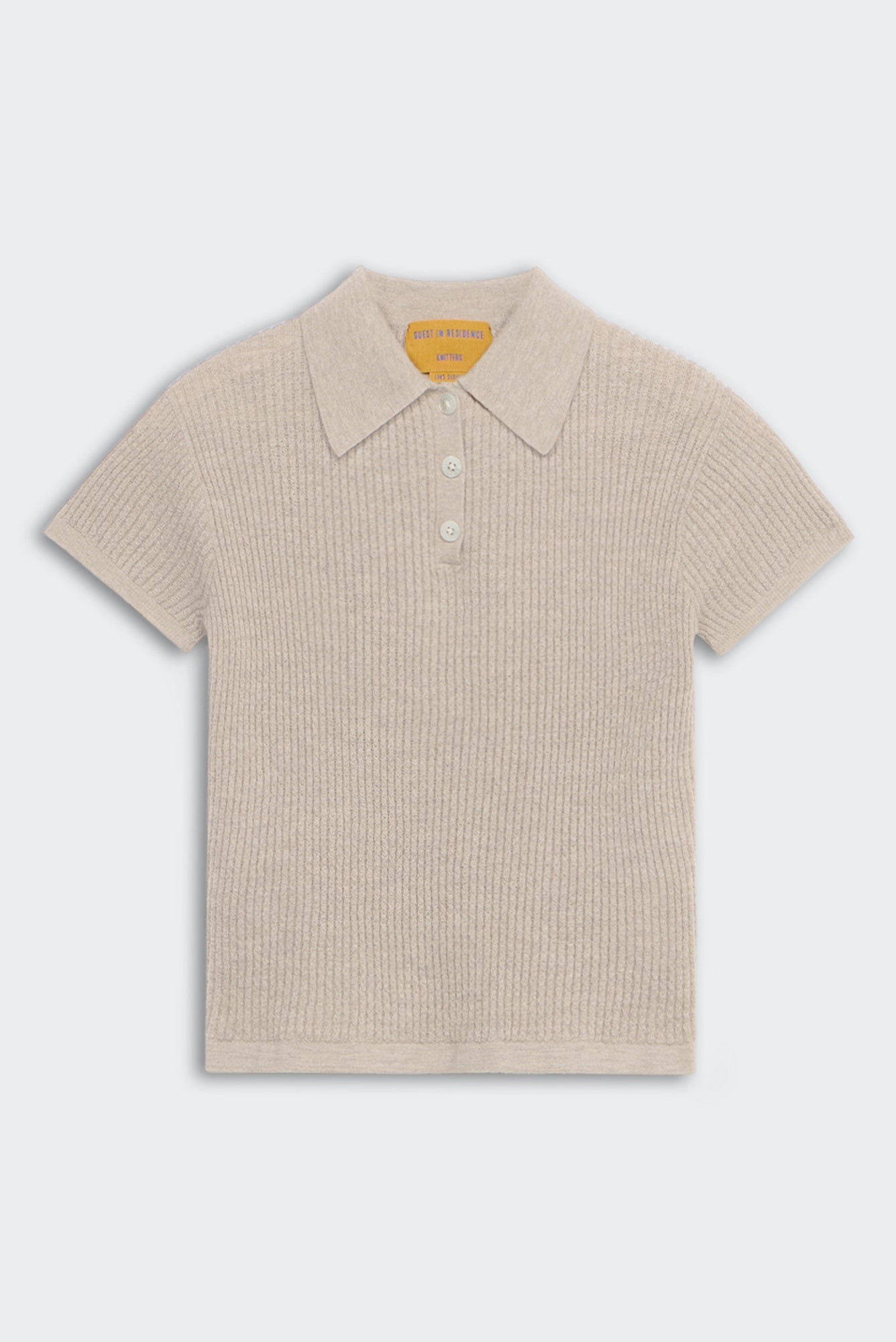 Beige ribbed knit polo shirt on a light gray background