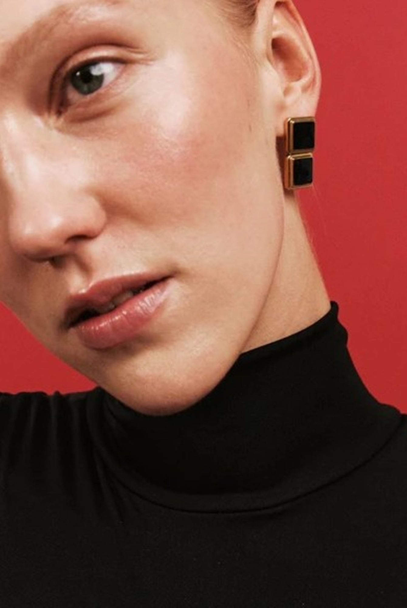 image of a model wearing the Heaven Mayhem archer drop earrings