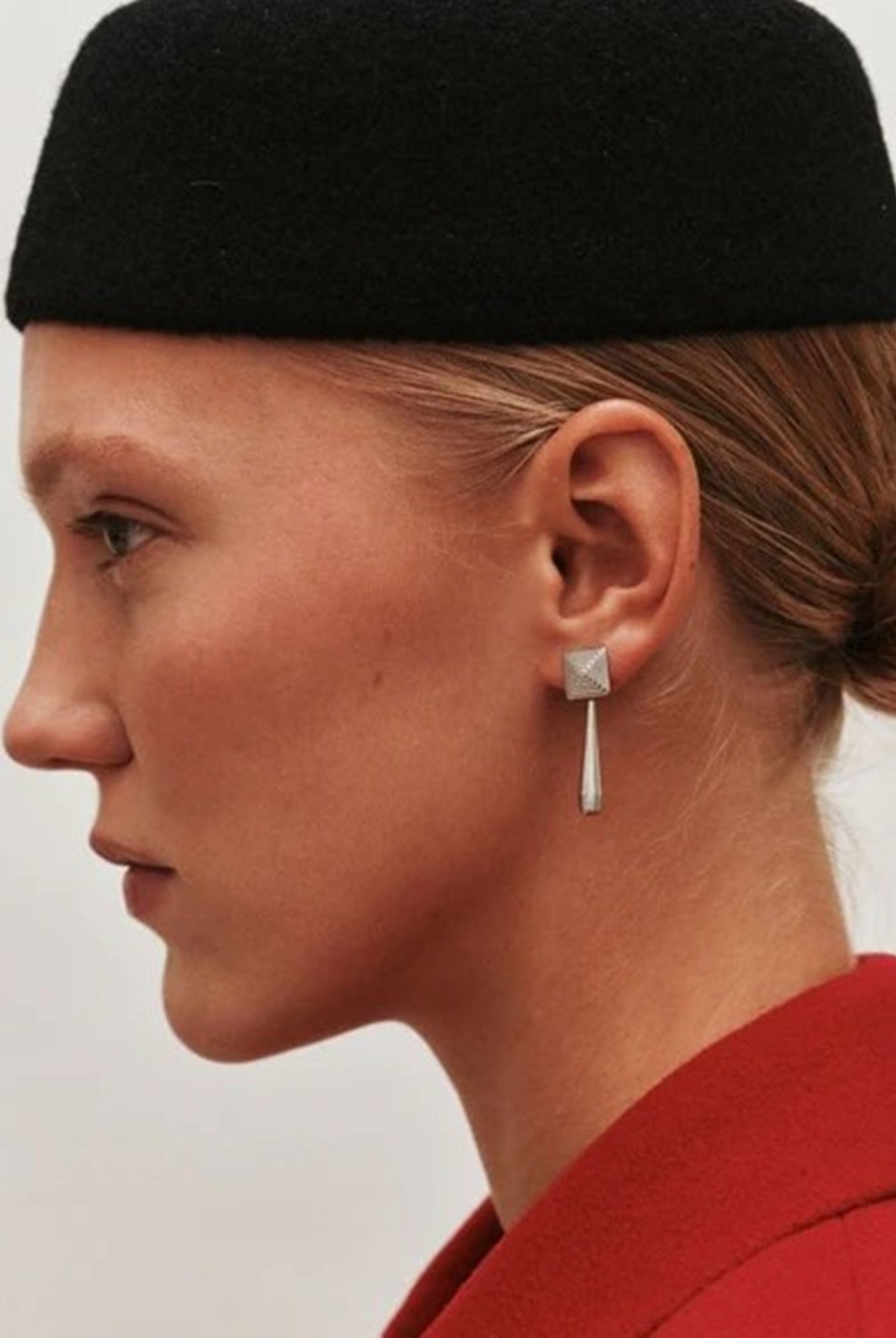 image of a woman wearing the Heaven Mayhem Iris Earrings in silver