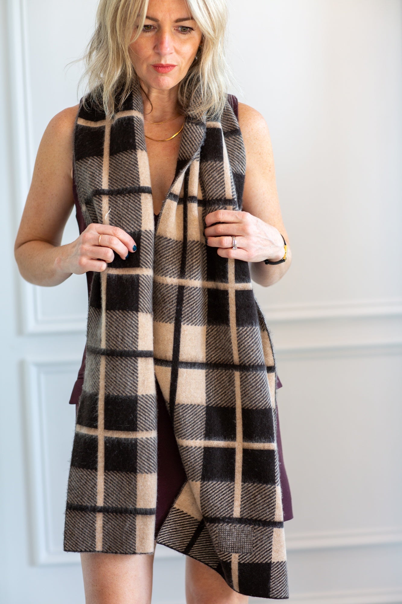 model wearing the guest in residence plaid scarf