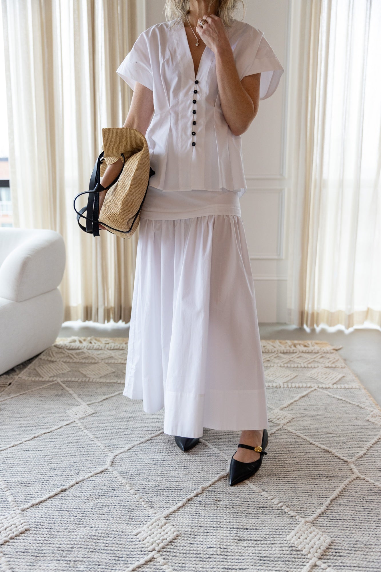 image of a woman wearing the House of Dagmar Cinched Cotton Top and Maxi Skirt
