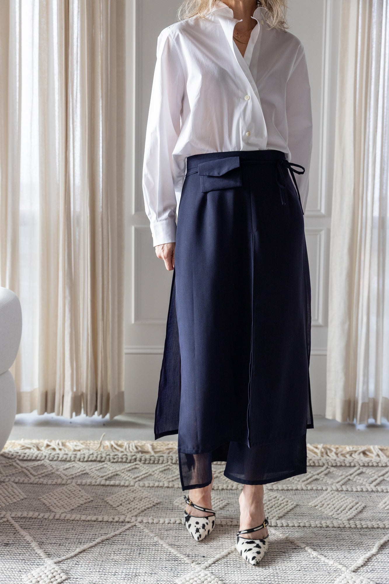 image of a woman wearing the house of dagmar cropped shirt and rachel comey gerri pants