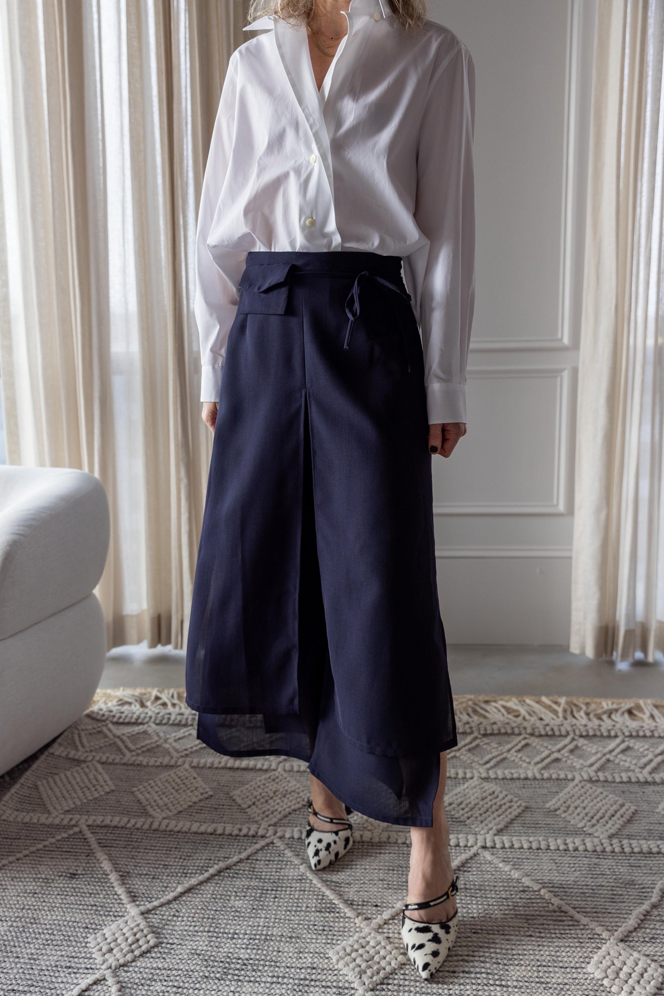image of a woman wearing house of dagmar cropped shirt and rachel comey gerri pants