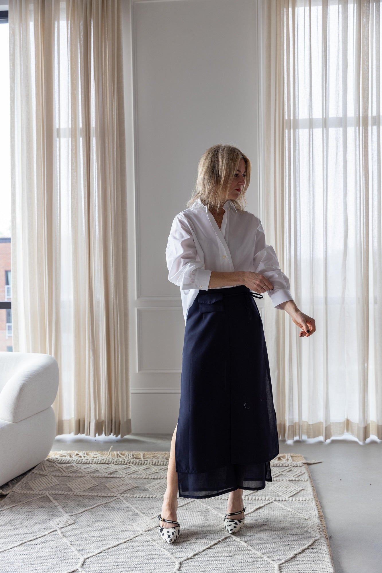 image of a woman wearing the house of dagmar cropped shirt and rachel comey gerri pants