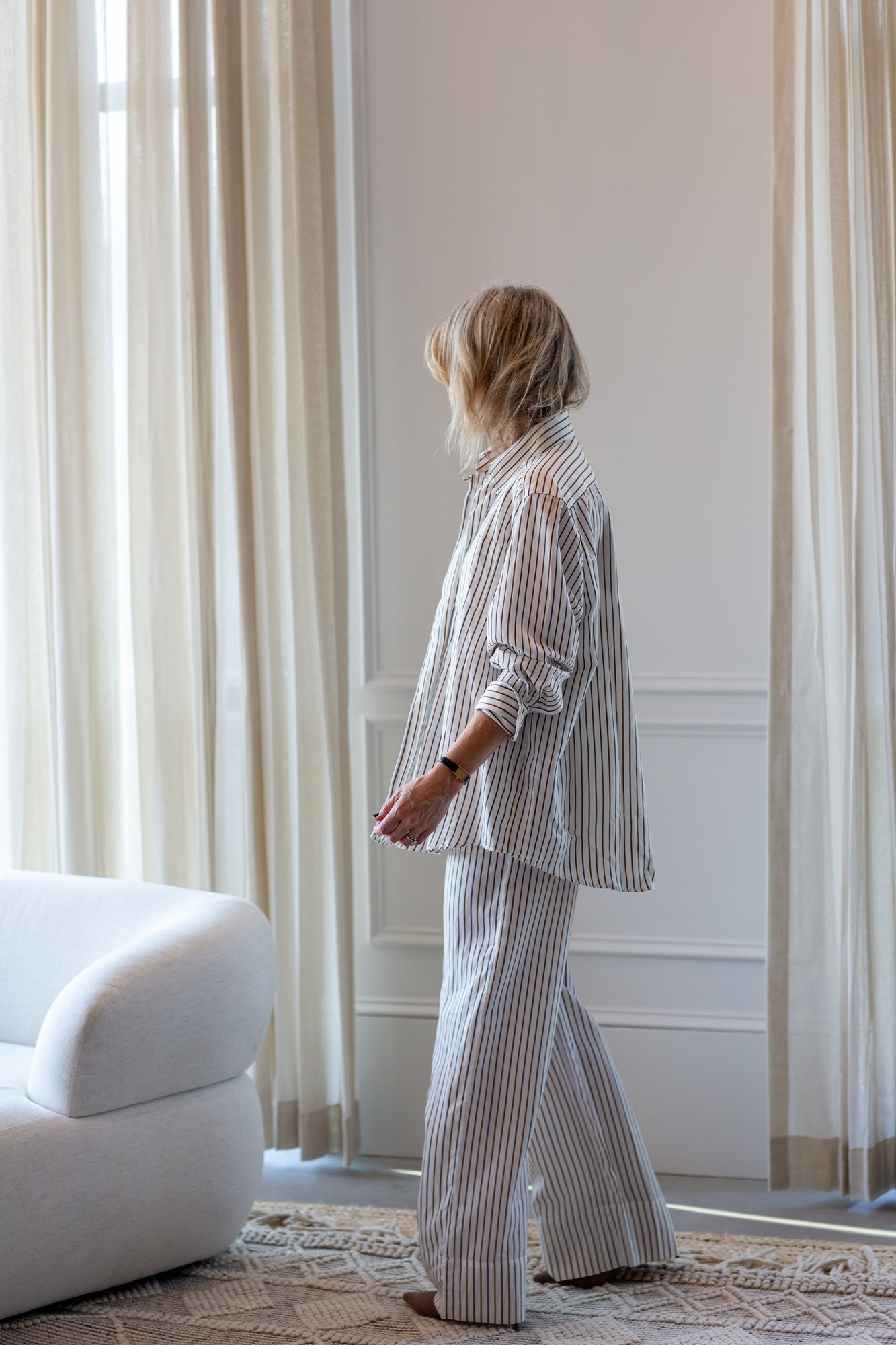 model wearing the house of dagmar fluid stripe relaxed trousers