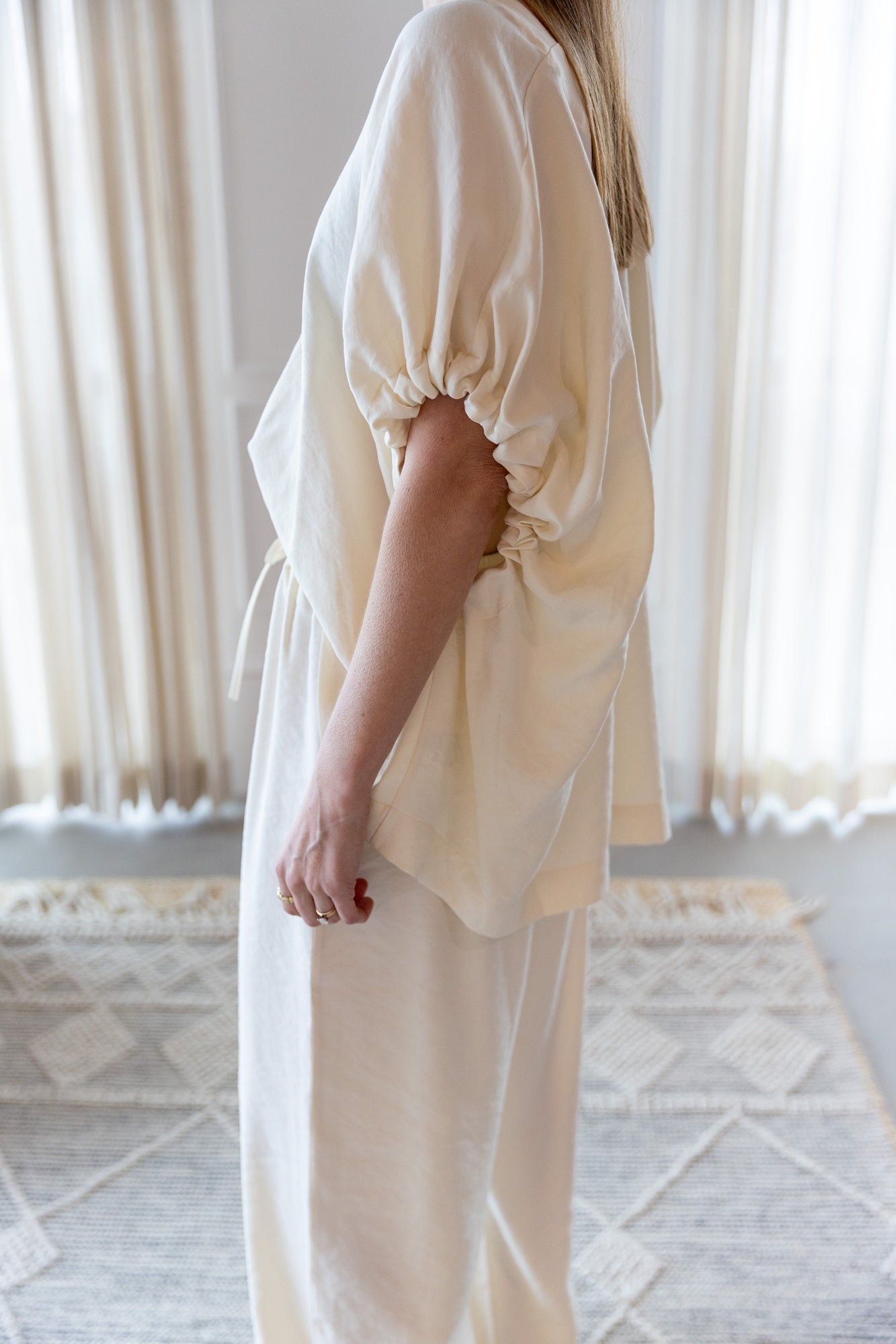image of a woman wearing the House of Dagmar Ruched V Neck Top and Drawstring Pants