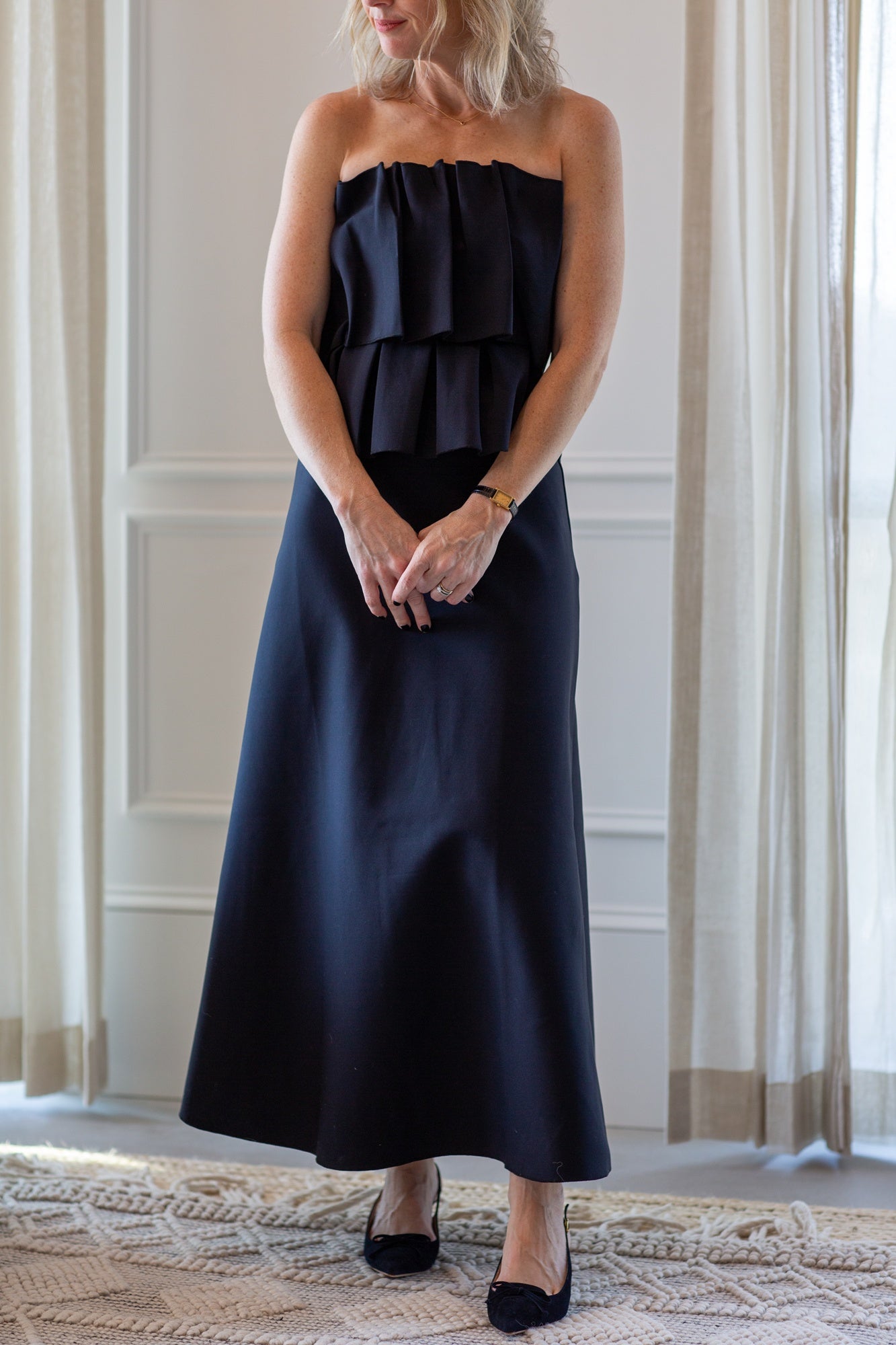 woman wearing the house of dagmar sculpted tube dress in black