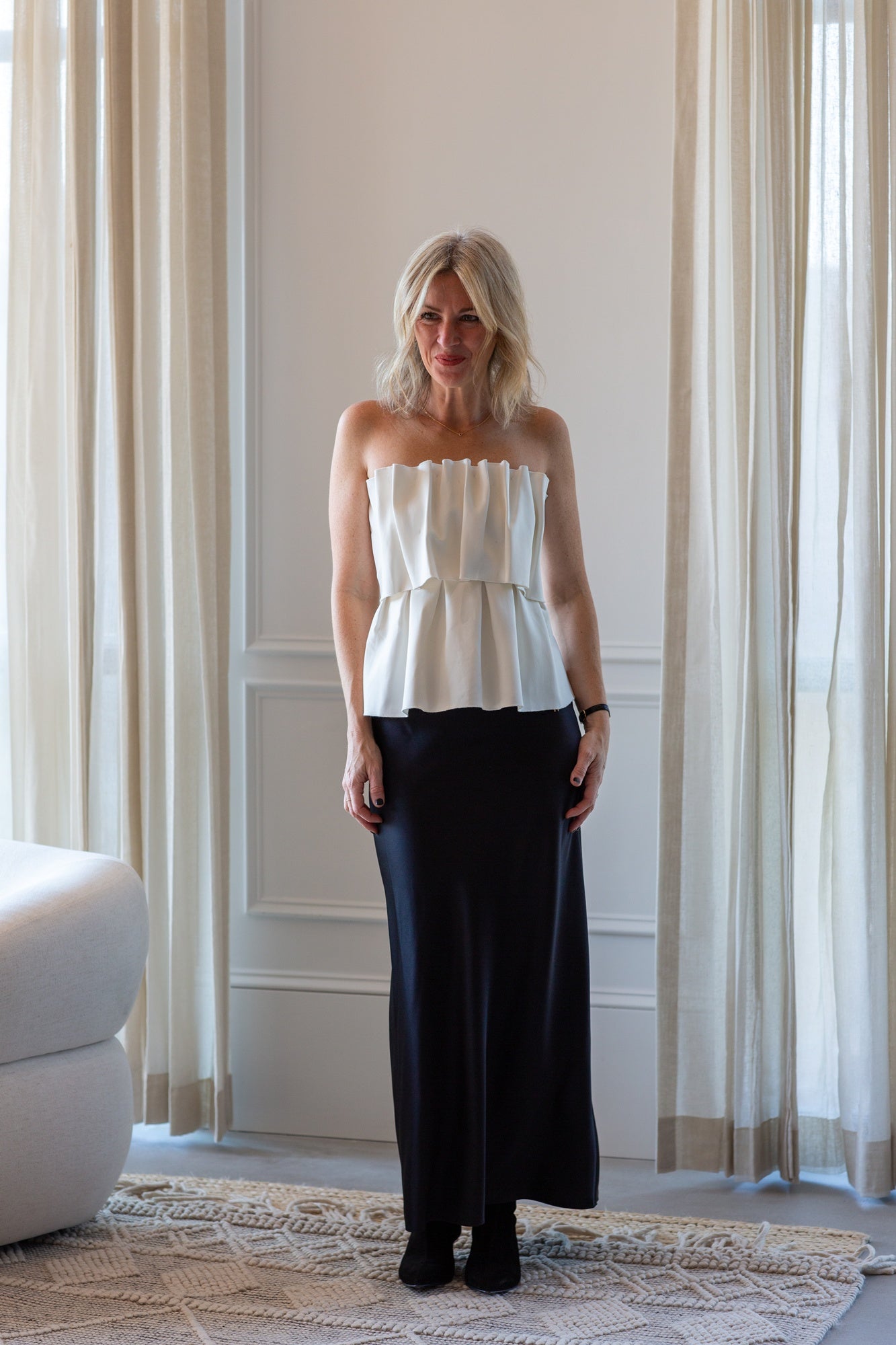 model wearing the house of dagmar sculpted tube top and eterne camila skirt