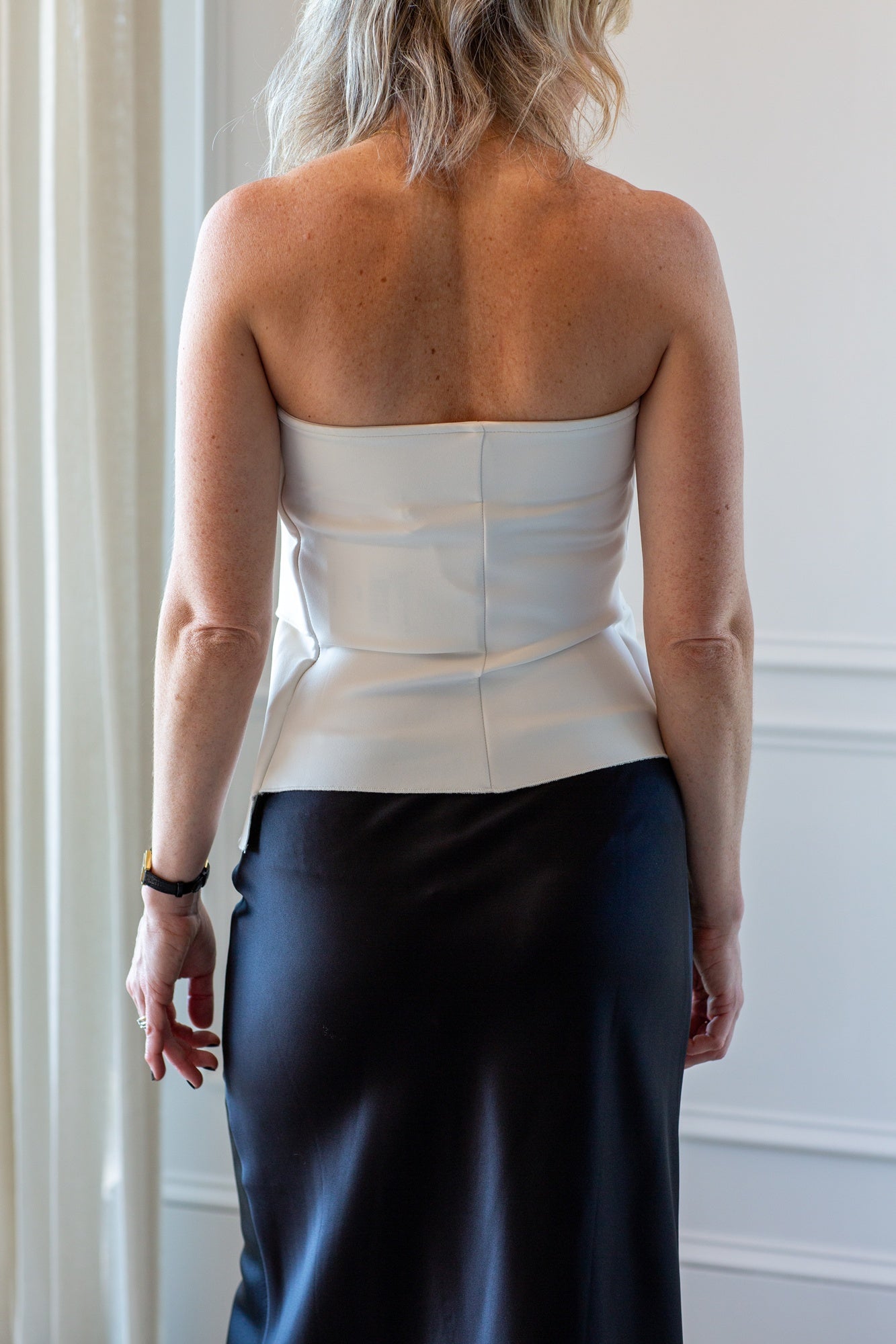 model wearing the house of dagmar sculpted tube top and eterne camila skirt