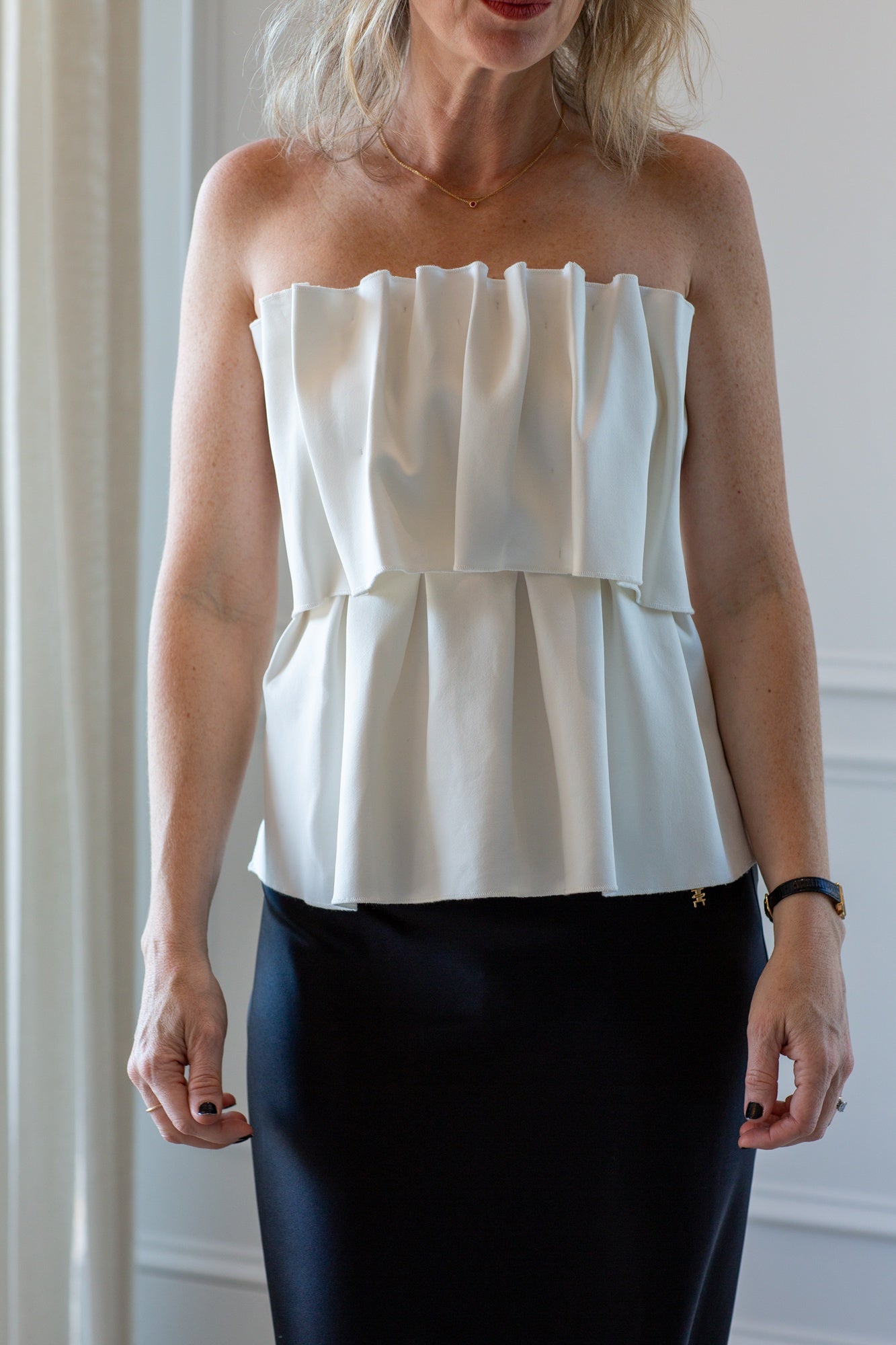 model wearing the house of dagmar sculpted tube top and eterne camila skirt