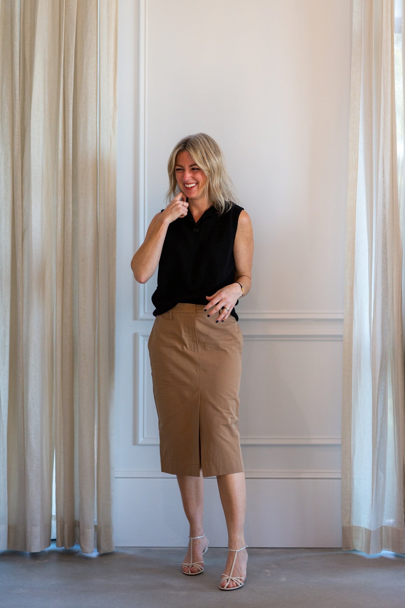 model wearing the Herskind grace skirt and house of dagmar sleeveless cashmere top