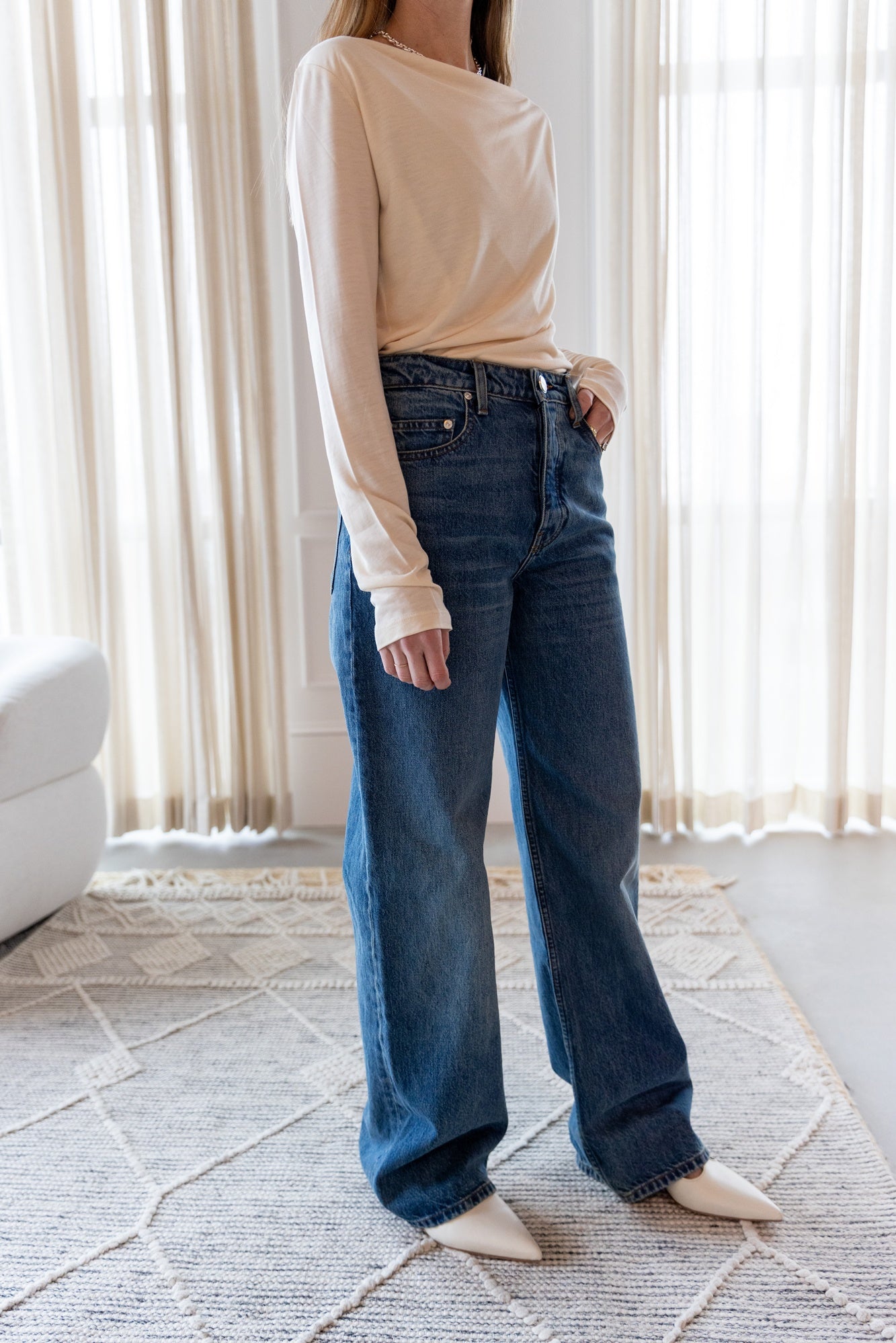 image of a woman wearing the House of Dagmar Square Neck Top and Sablyn Sammy Jeans
