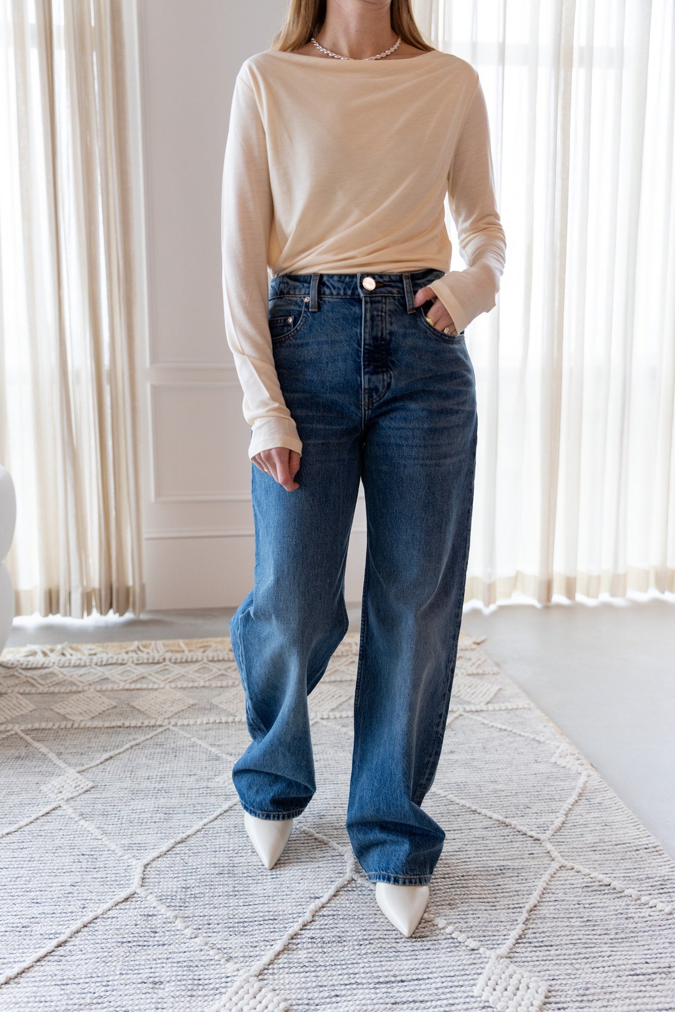 image of a woman wearing the House of Dagmar Square Neck Top and Sablyn Sammy Jeans