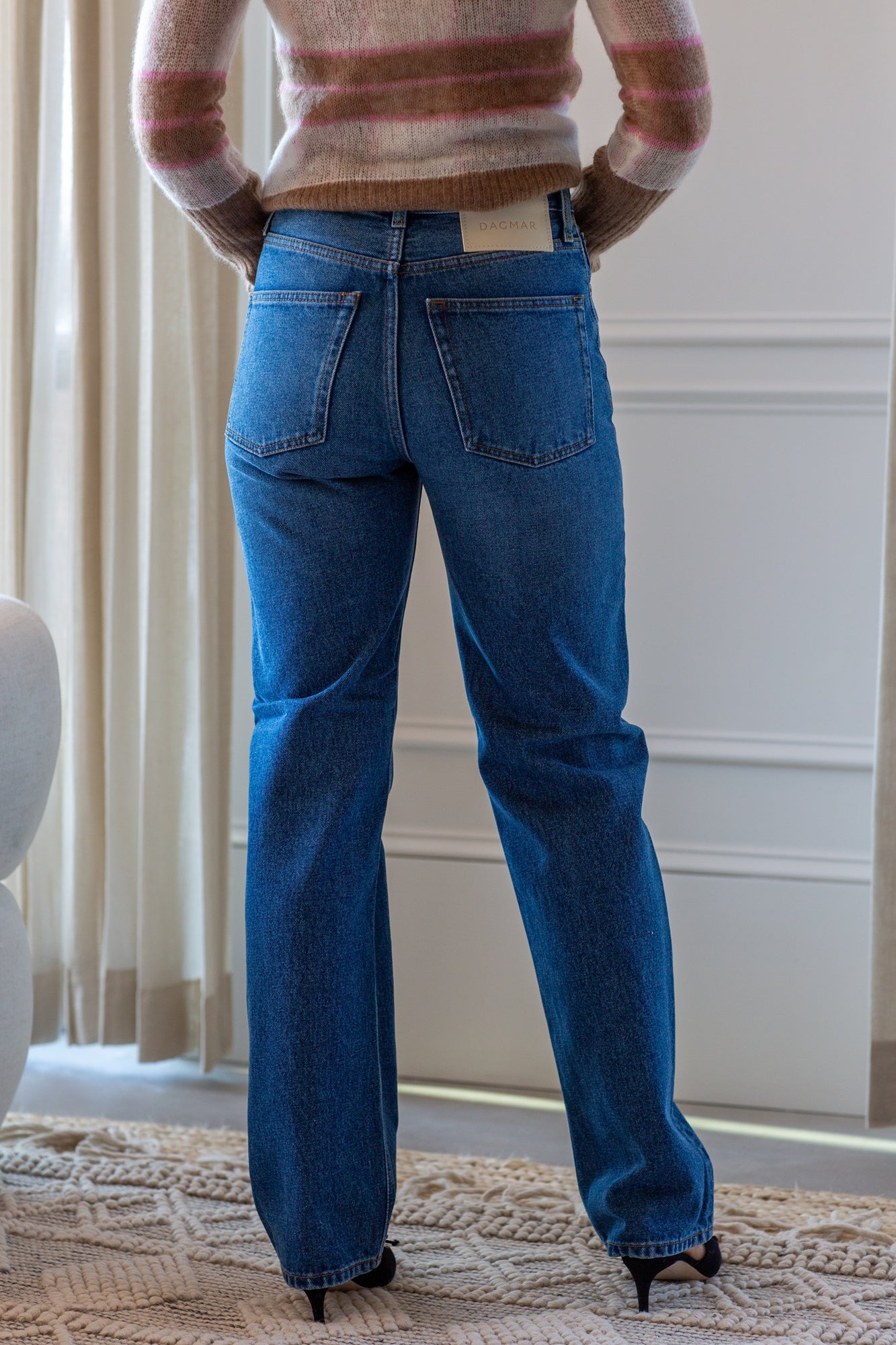 woman wearing the house of dagmar straight leg jeans