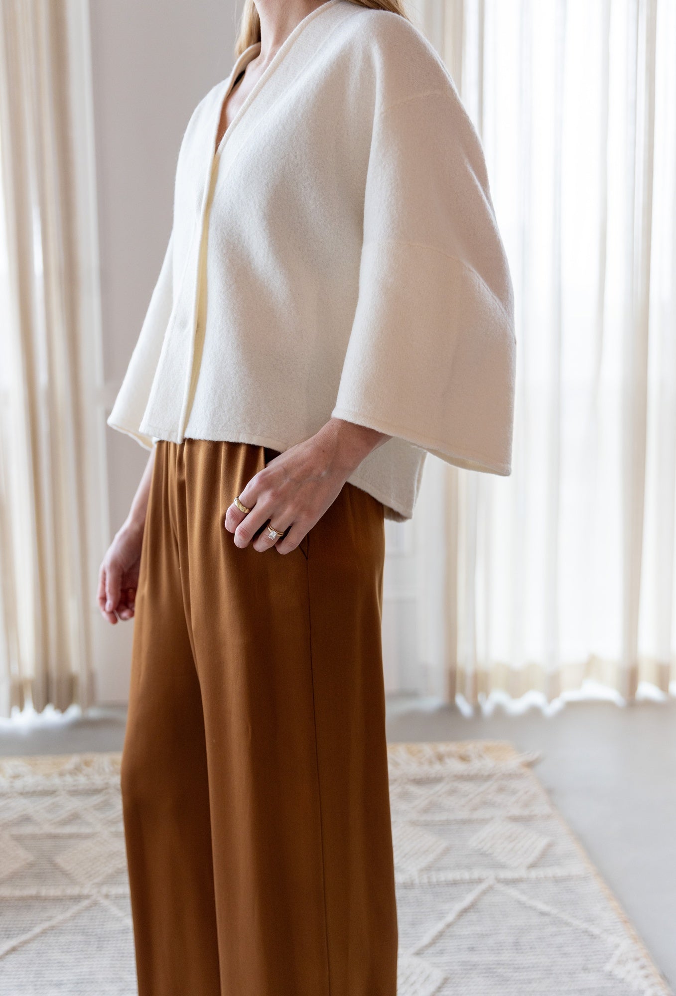 image of a woman wearing the House of Dagmar Wool Cardigan and Sablyn Brynn Pants