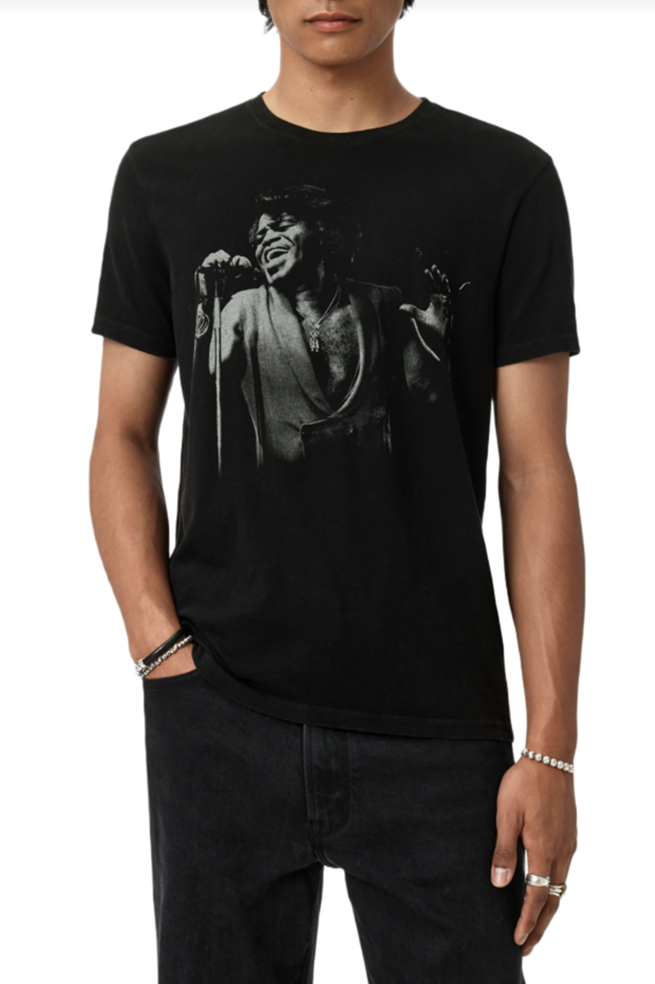 Person wearing a black t-shirt with a graphic design on a white background