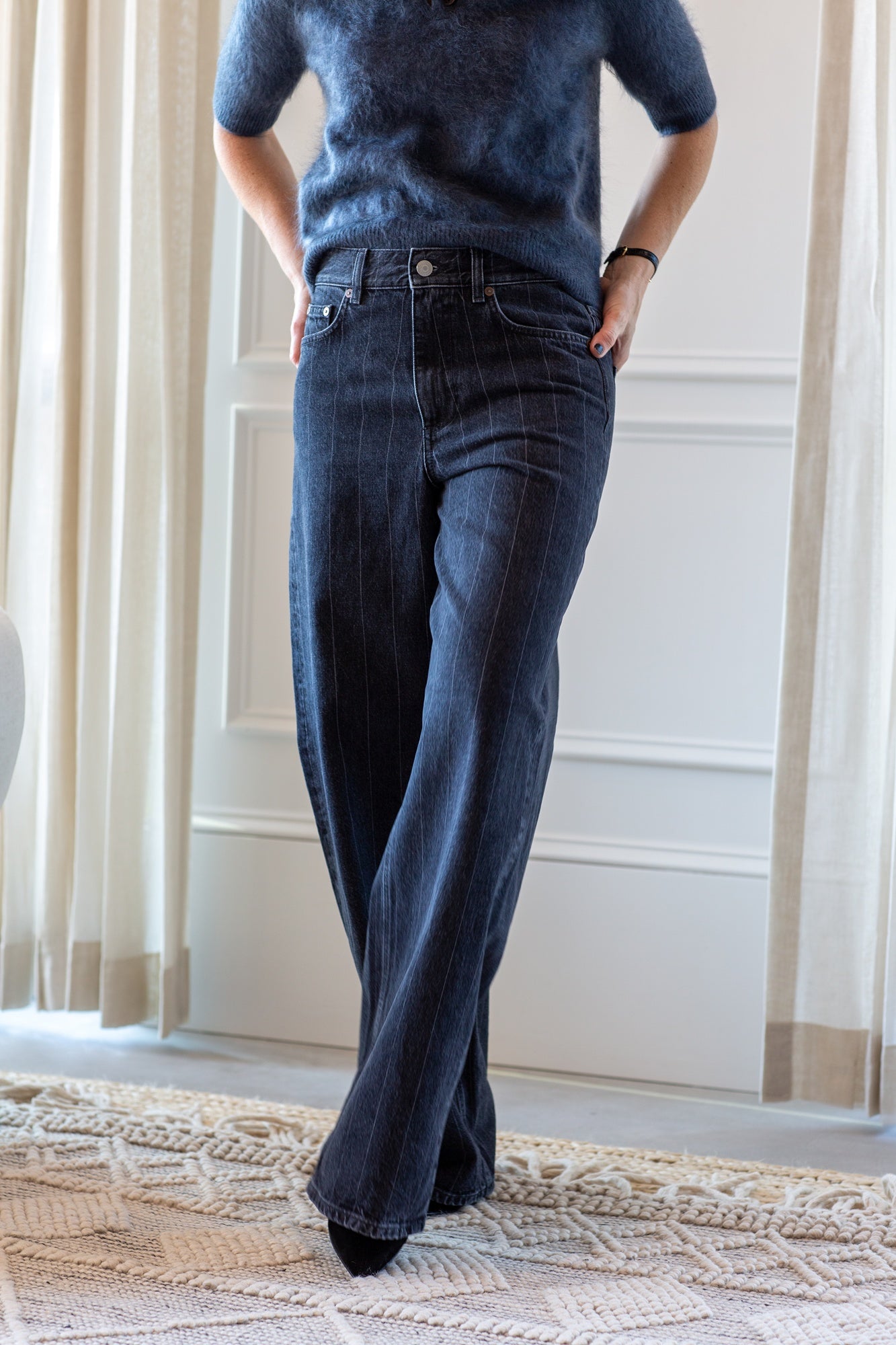 model wearing the lisa yang carolyn brushed cashmere sweater and house of dagmar baggy cut jeans
