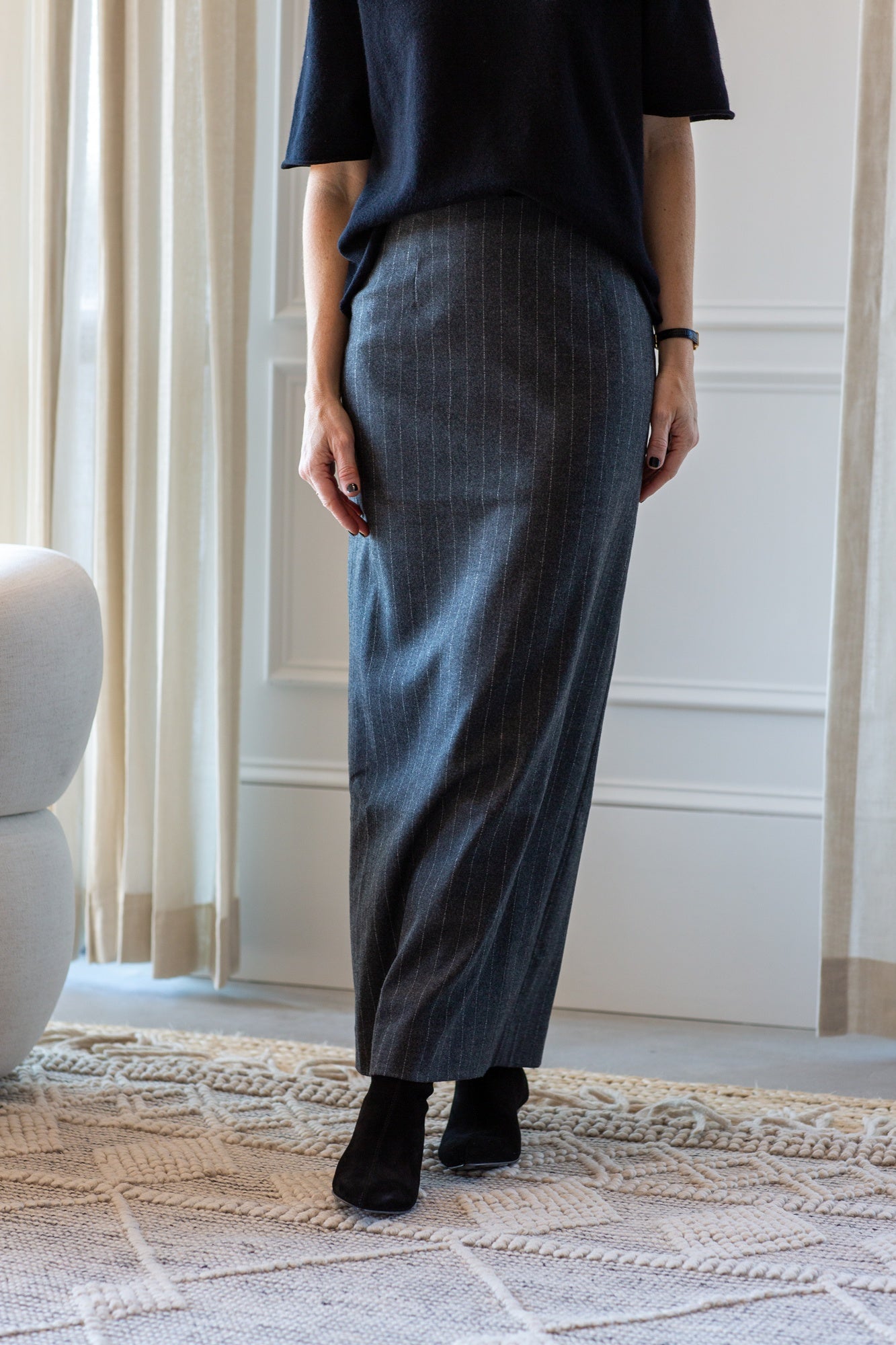 model wearing the lisa yang cila sweater and house of dagmar pinstripe pencil skirt