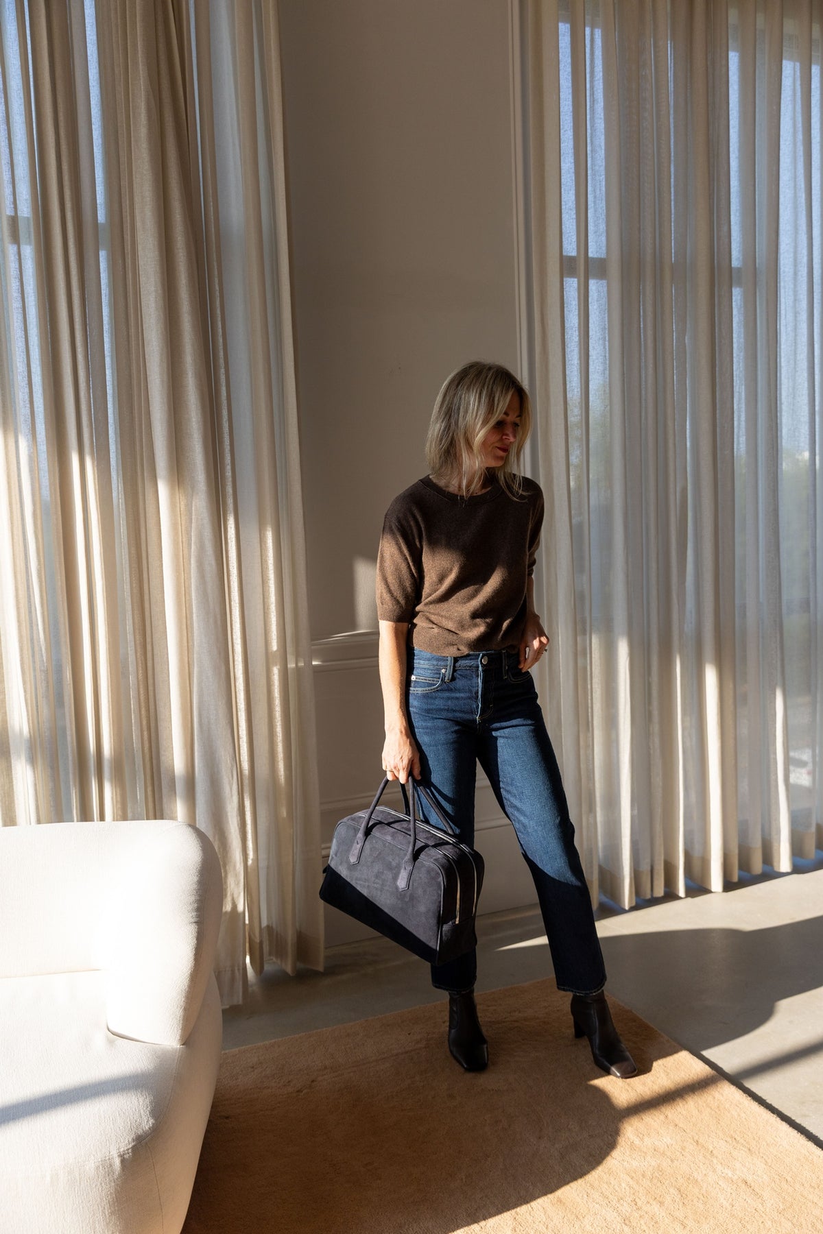 Lisa Yang Genevra T-Shirt in dark truffle cashmere, full-length styled look with AMO jeans and A. Emery Talbot bag