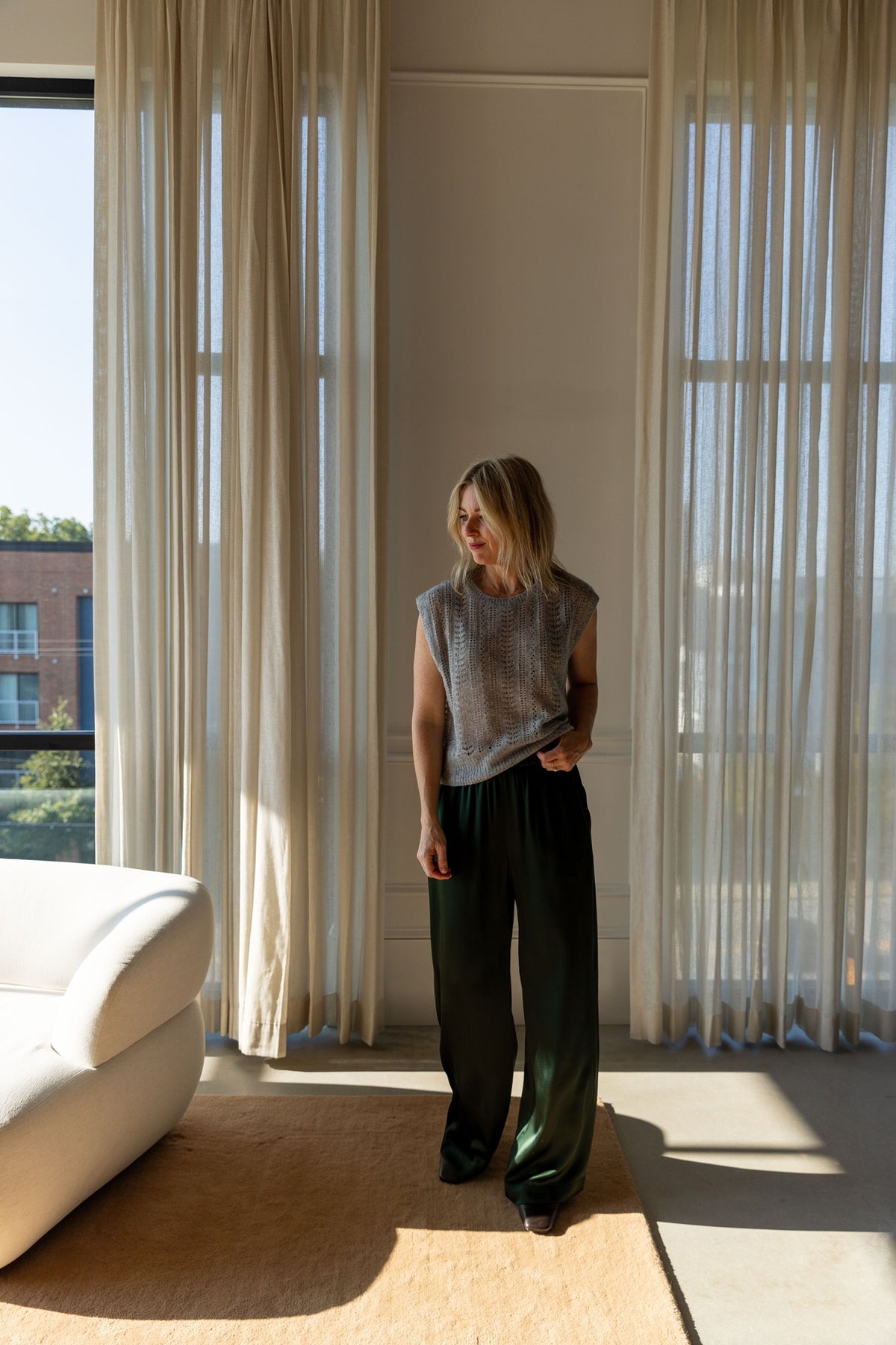 Lisa Yang Nian Vest in cloudy grey with wide-leg green Sablyn Brynn silk pants in natural light