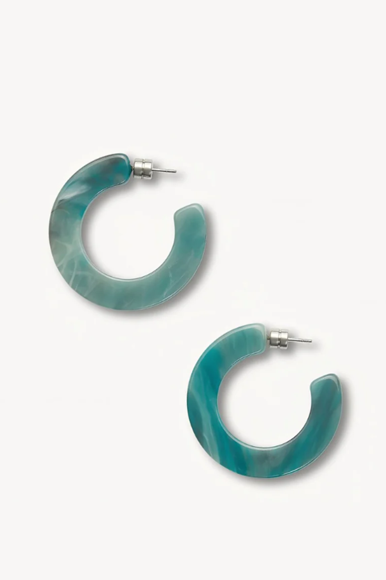 Teal or jadeite hoop earrings on a white background