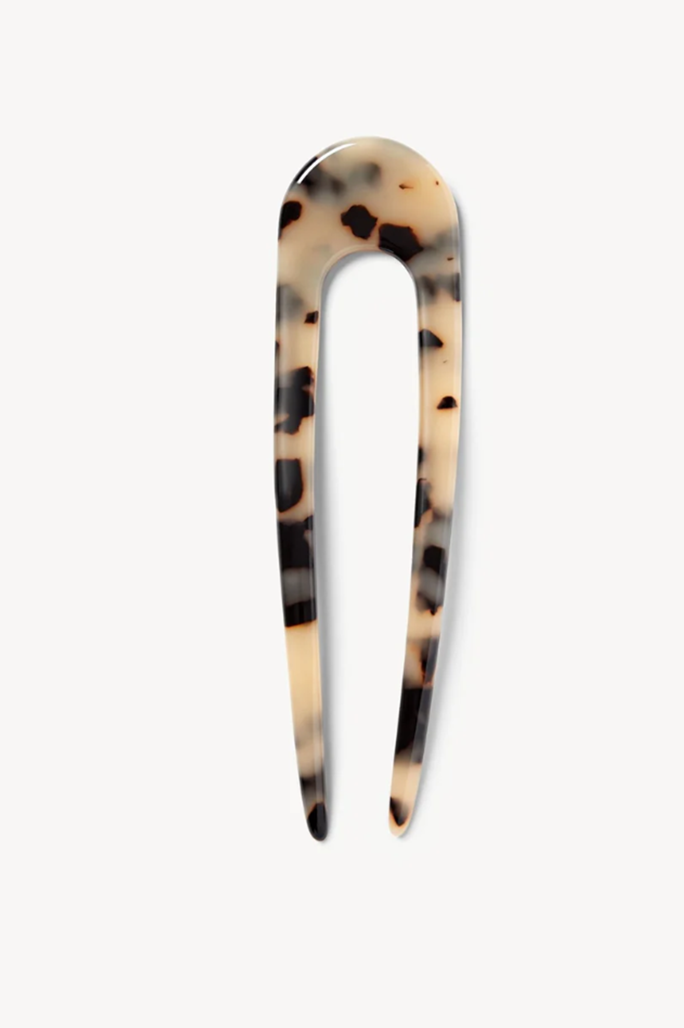 Tortoiseshell patterned hair clip on a white background