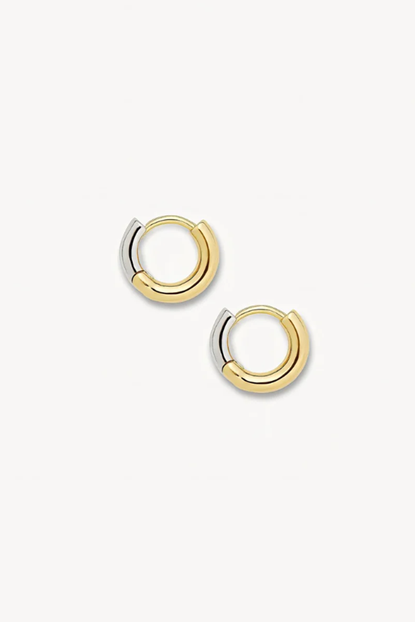 Gold hoop earrings on a white background