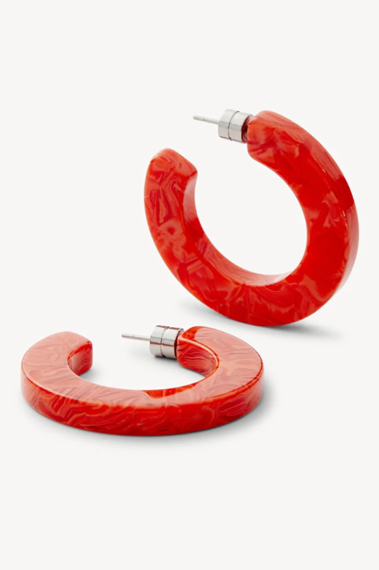 Pair of red or poppy hoop earrings on a white background