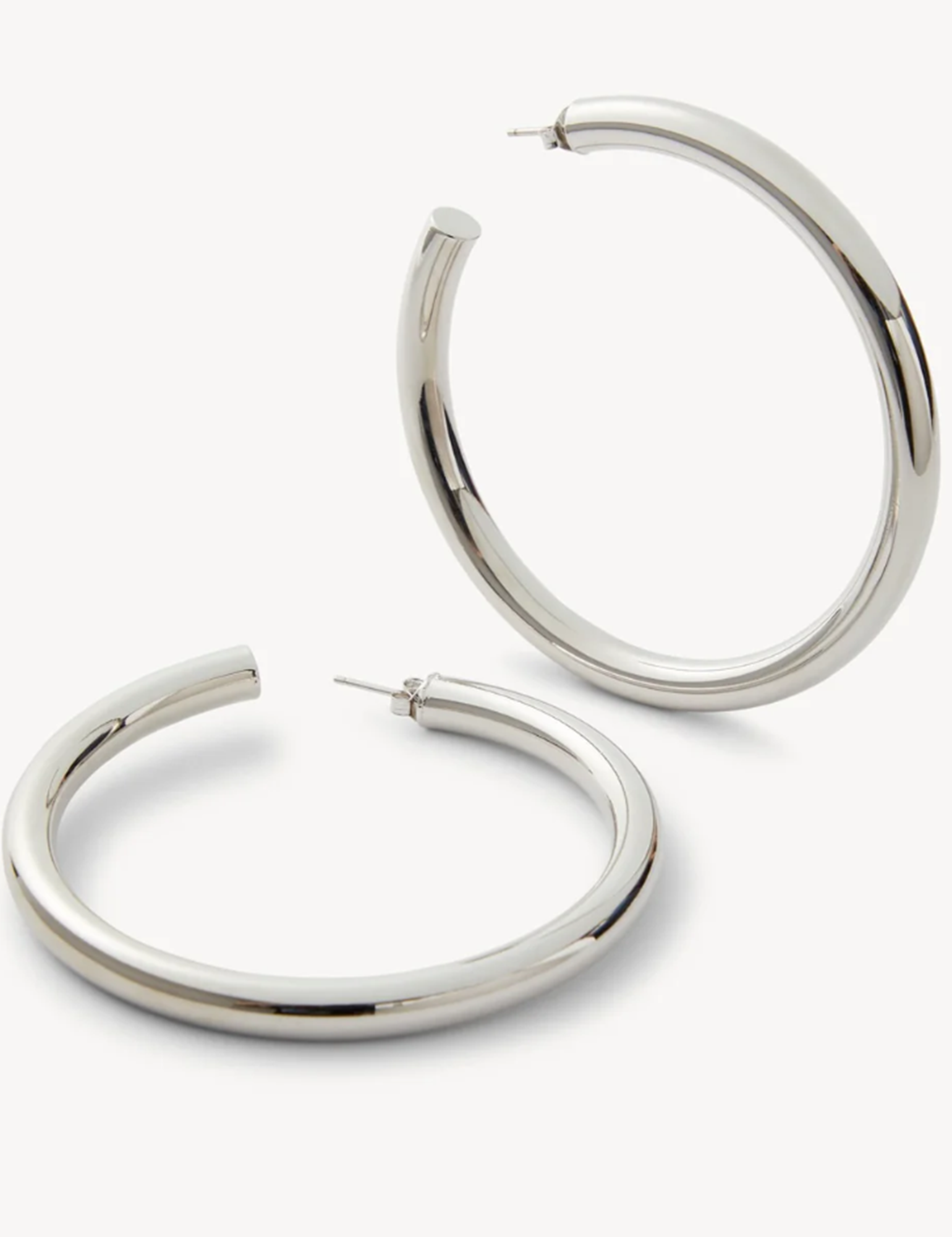 Pair of silver hoop earrings on a white background