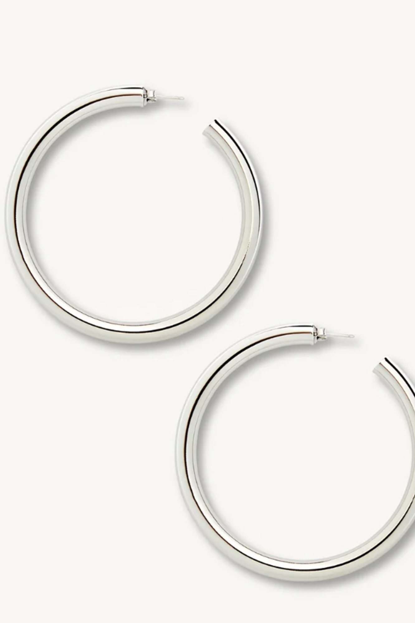 Silver hoop earrings on a white background
