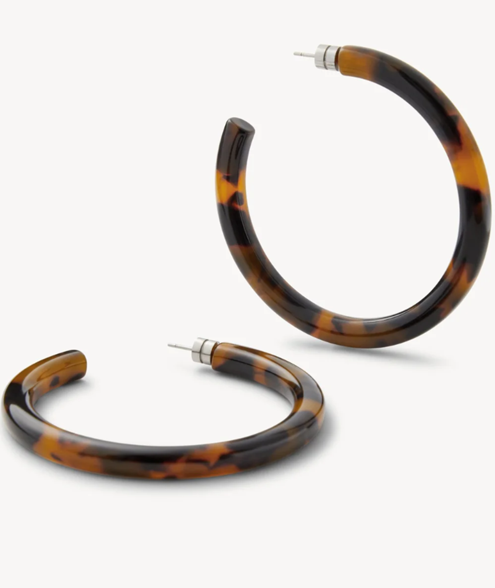 Tortoiseshell hoop earrings on a white background
