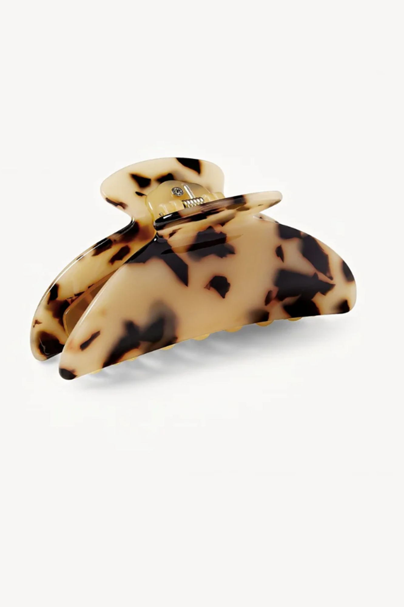 Tortoiseshell patterned hair clip or claw on a white background